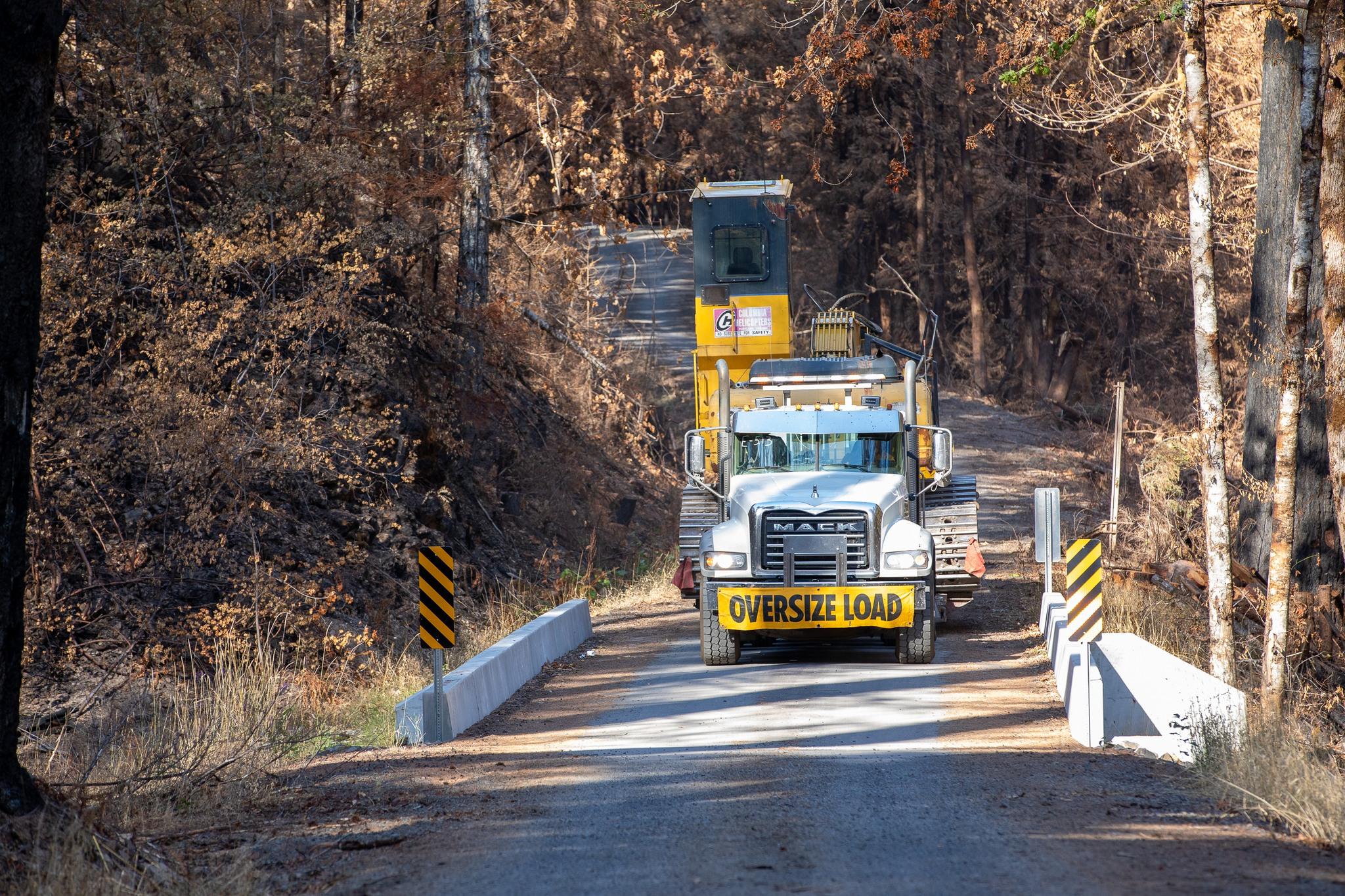 This wide load is helping make the roads safer by removing fire-weakened trees