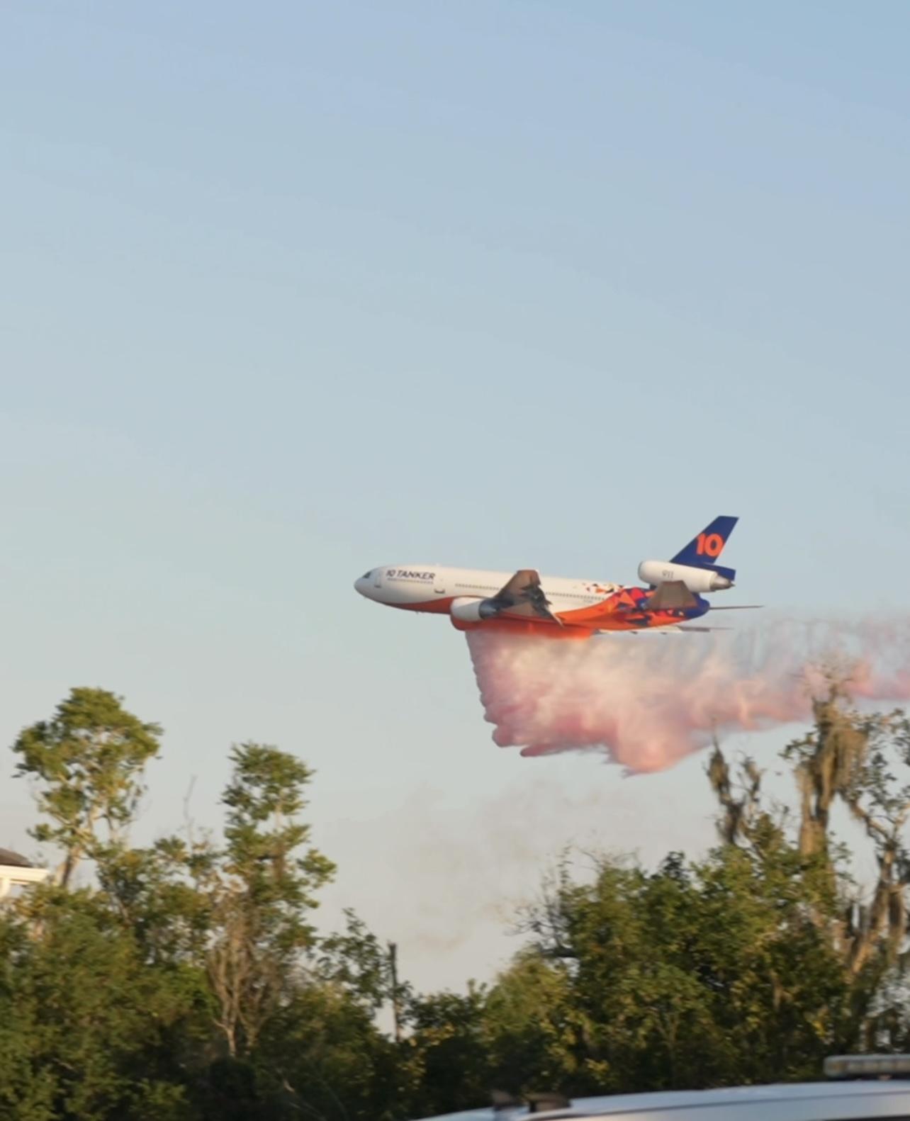 This is an image of a plane dropping water