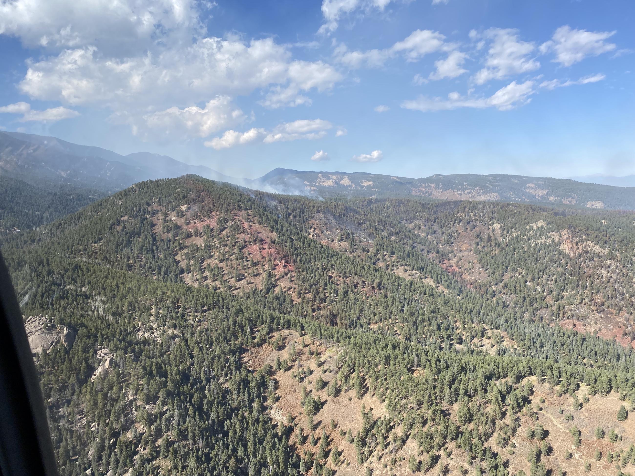 an aerial view of smoke and retardant lines on the Saint Charles Fire