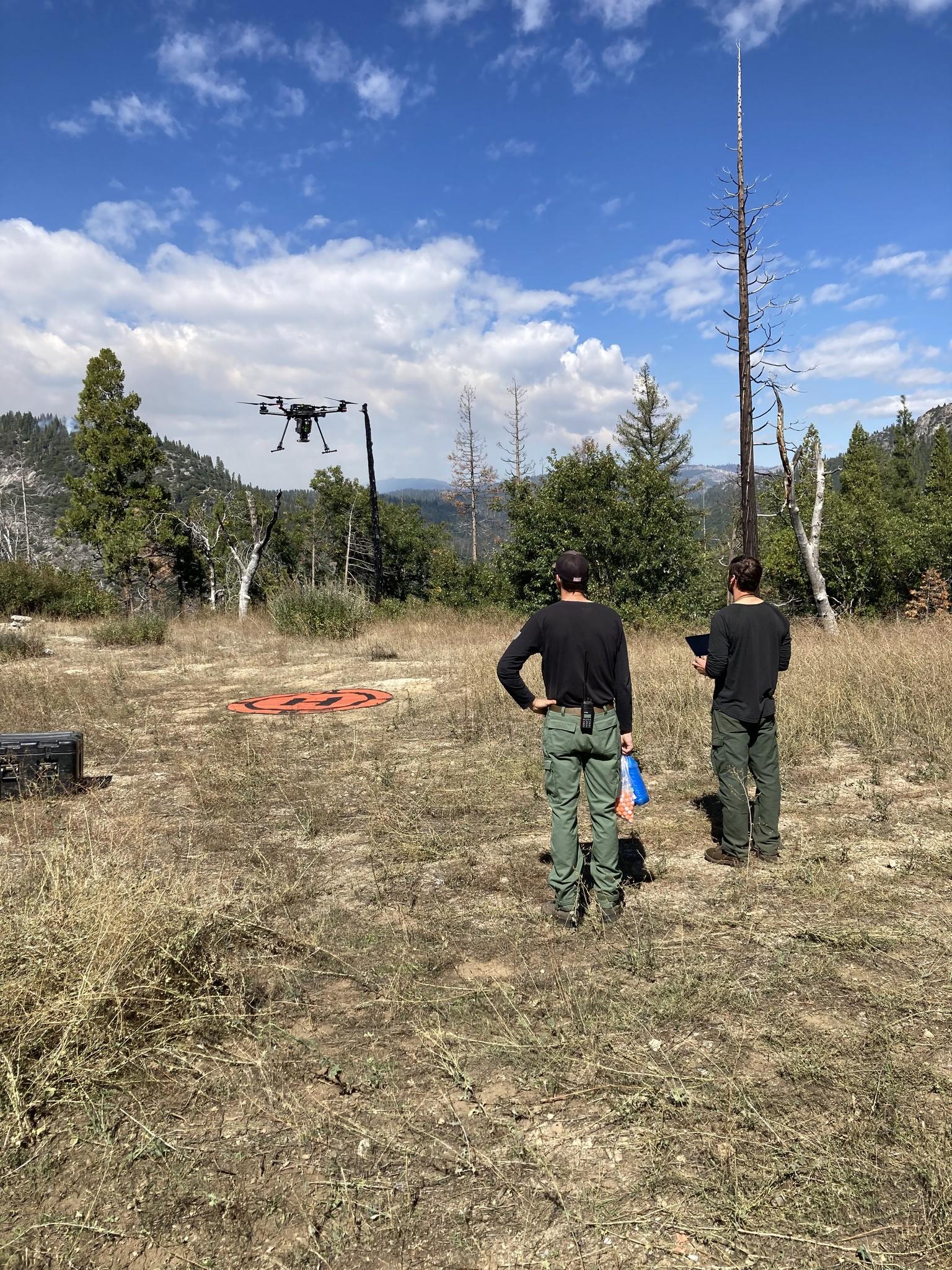 Pilots landing Unmanned Aerial System (drone)