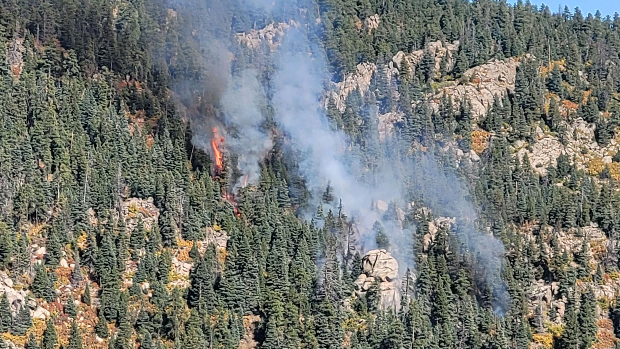 Saint Charles Fire initial response to incident. Smoke and some flames in a steep canyon.