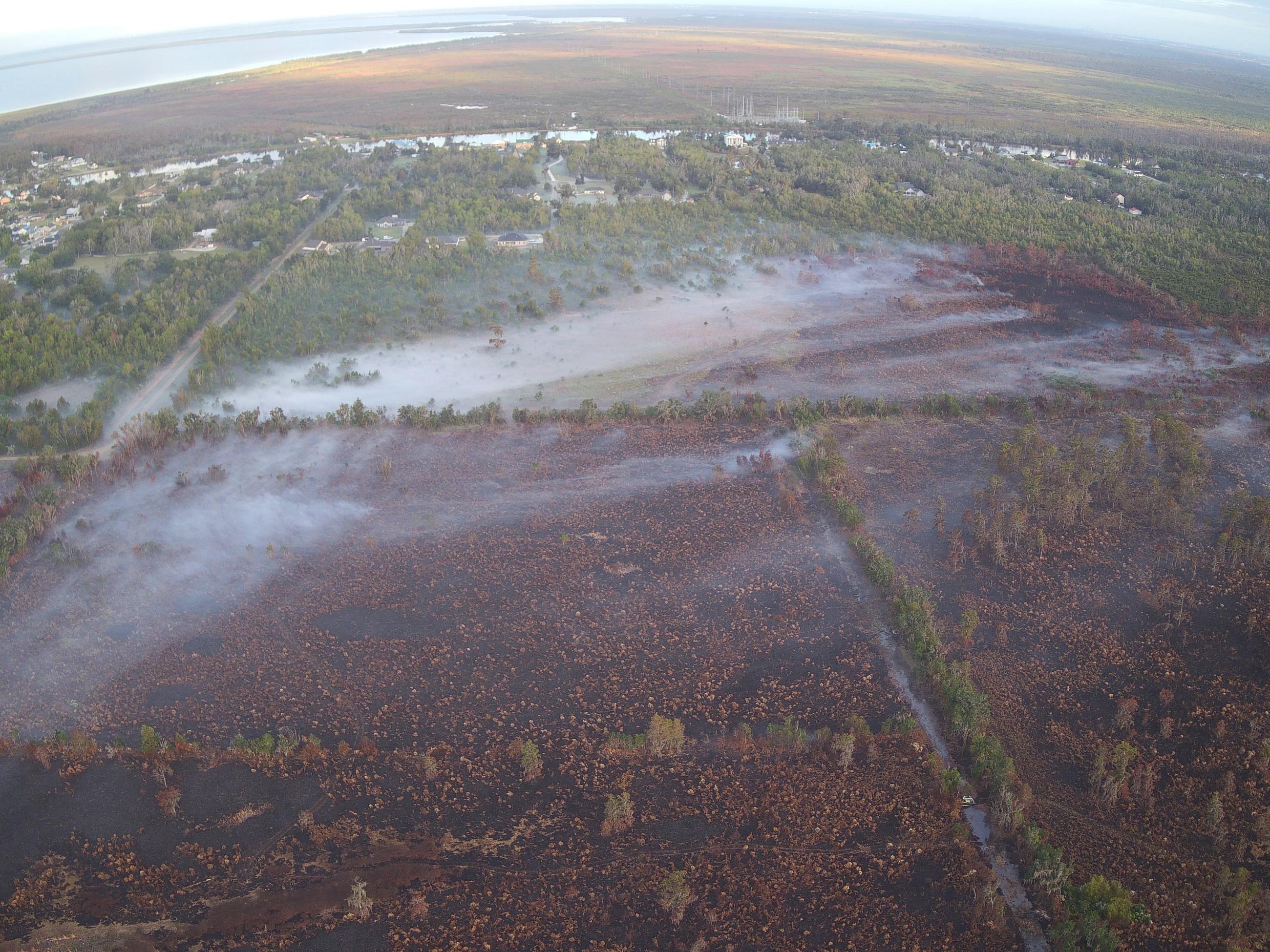 Smoke settles over the fire ground