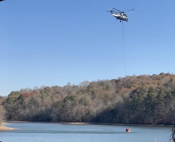 Type 1 helicopter collecting water from Nantahala Lake for bucket drops