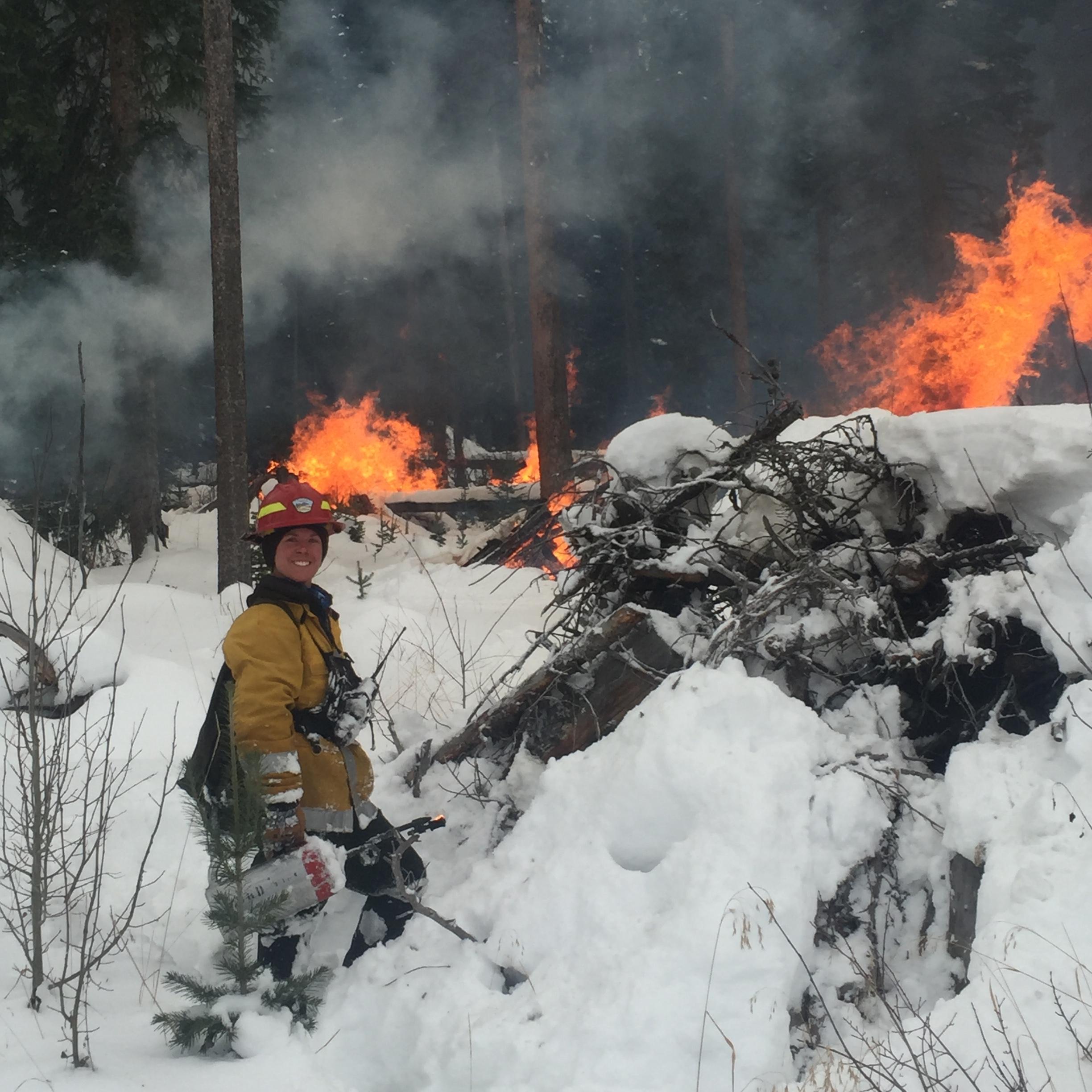 Firefighter burns piles in snow