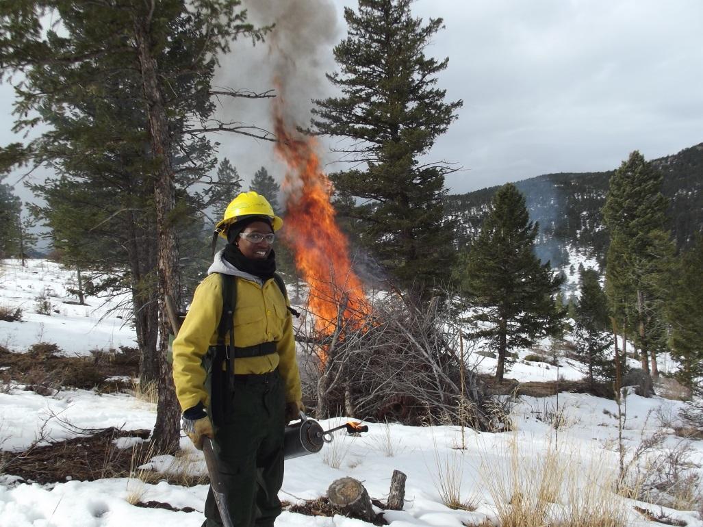 Firefighter burns piles near Boulder in early 2015