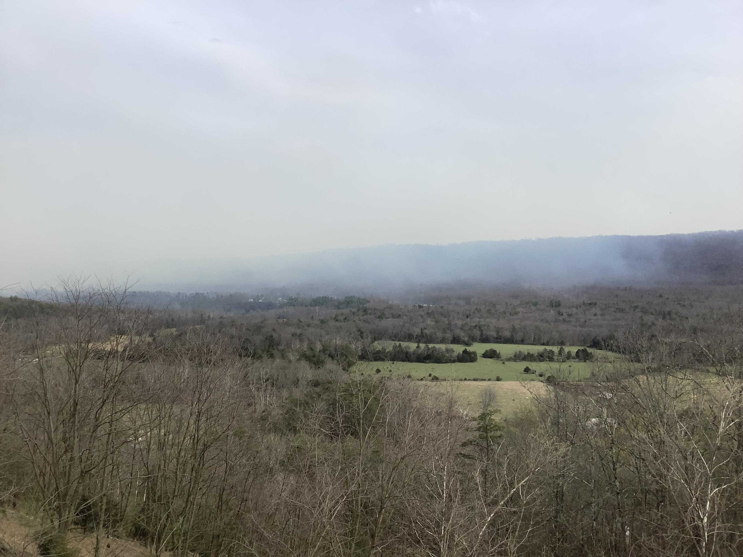 Smoke over green valley