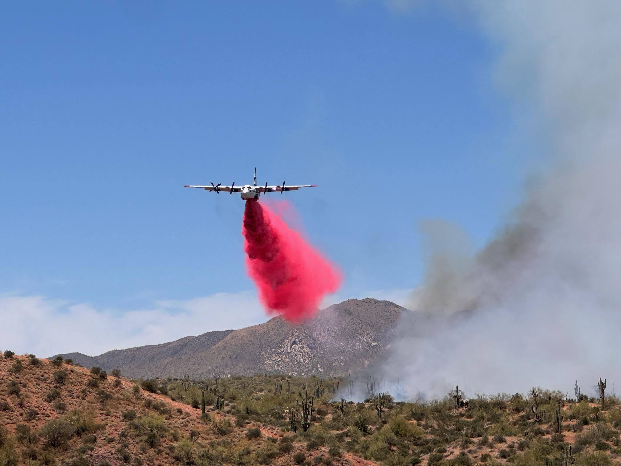 C130 airtanker dropping retardant on the edge of the Wildcat Fire Saturday, May 18, 2024