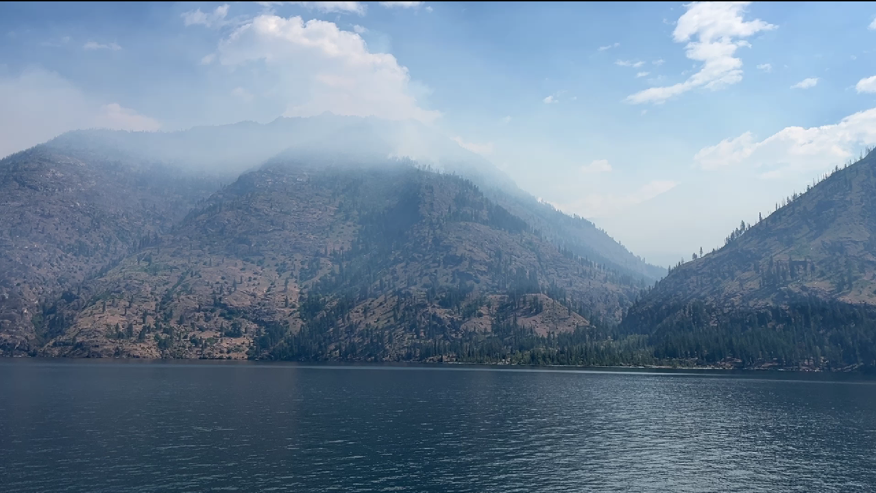 Pioneer Fire from Lady Express Ferry 6-21-24, showing smoke over the north shore of Lake Chelan