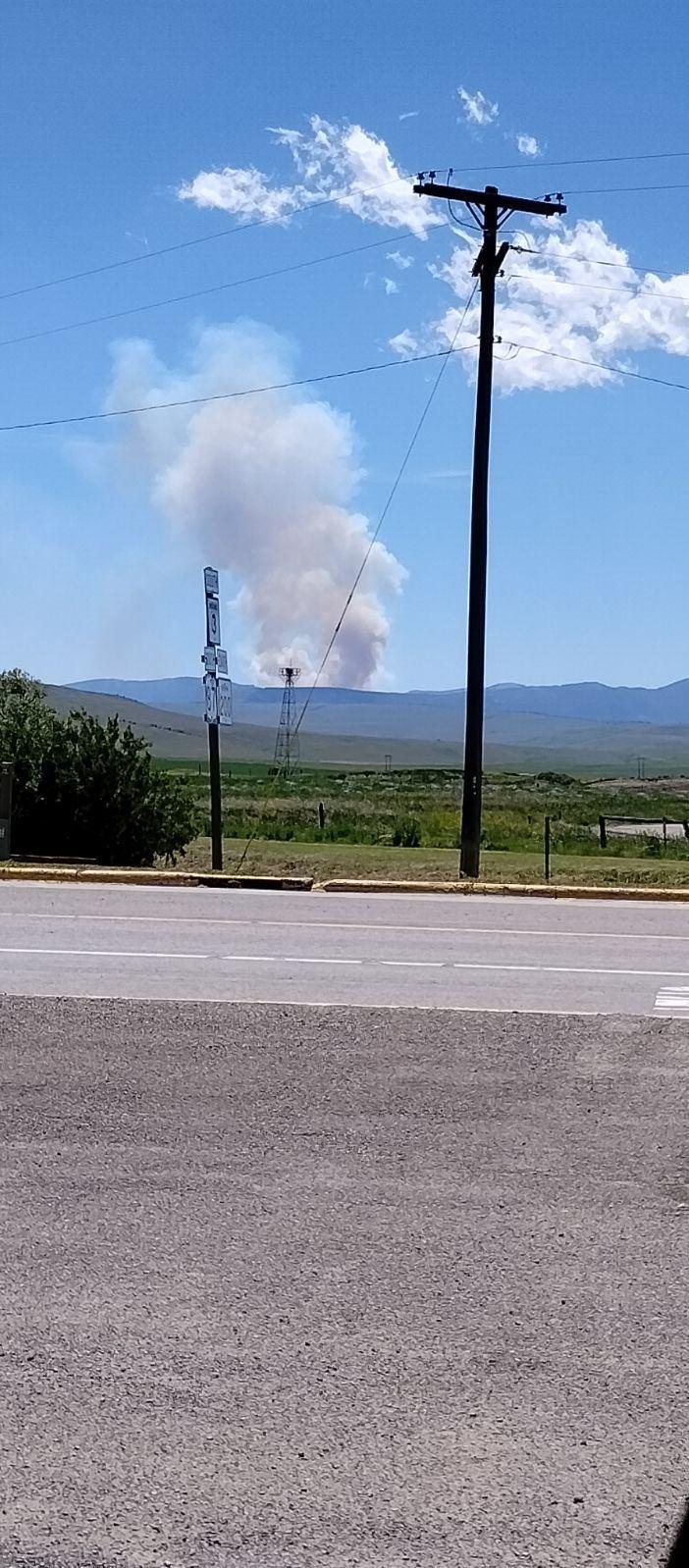 Plume of smoke from Running Wolf Fire, Tuesday, June 25 midday as seen from Highway near Stanford