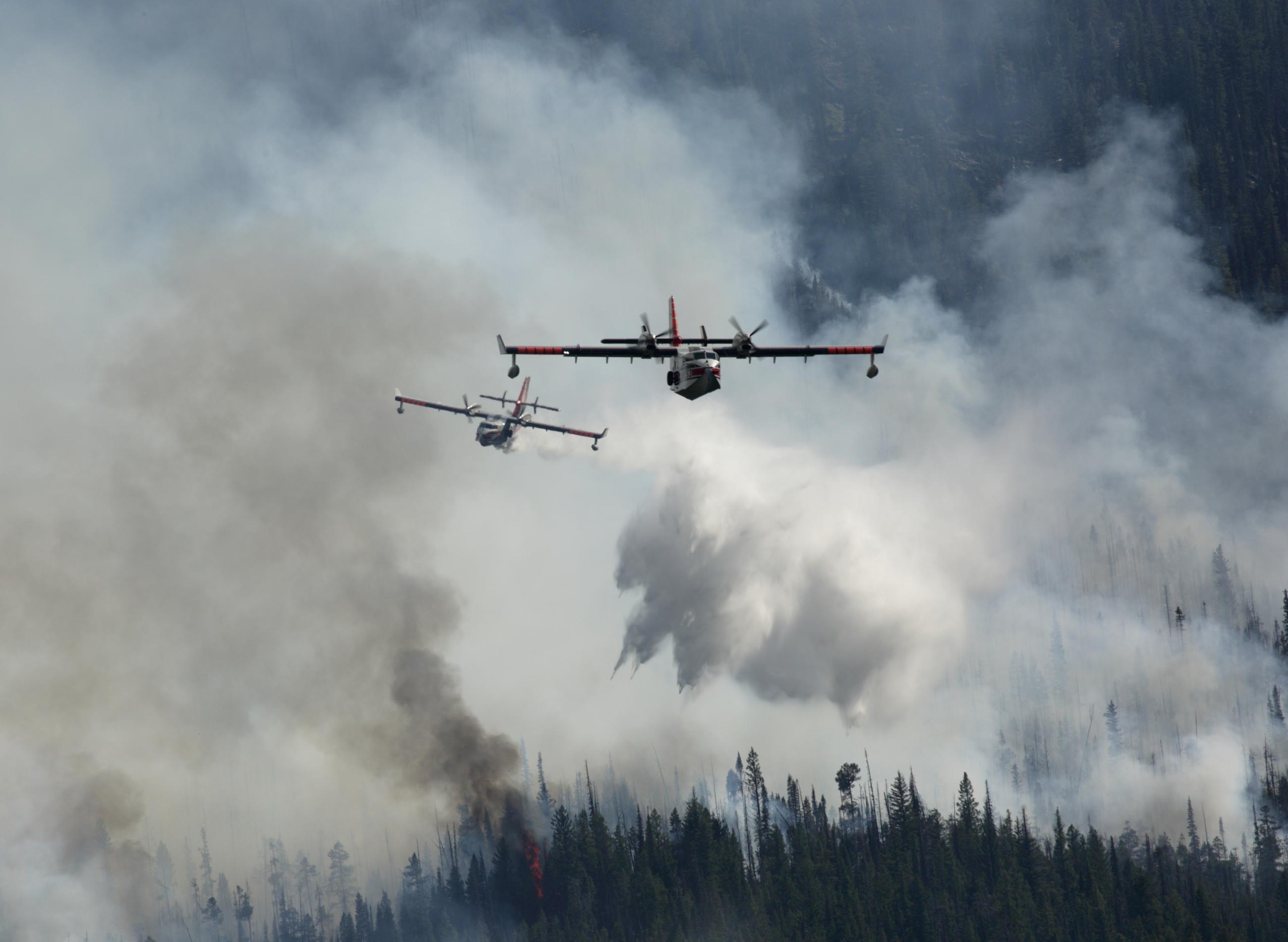 Aerial view of tandem scoopers dropping water, July 14, 2024