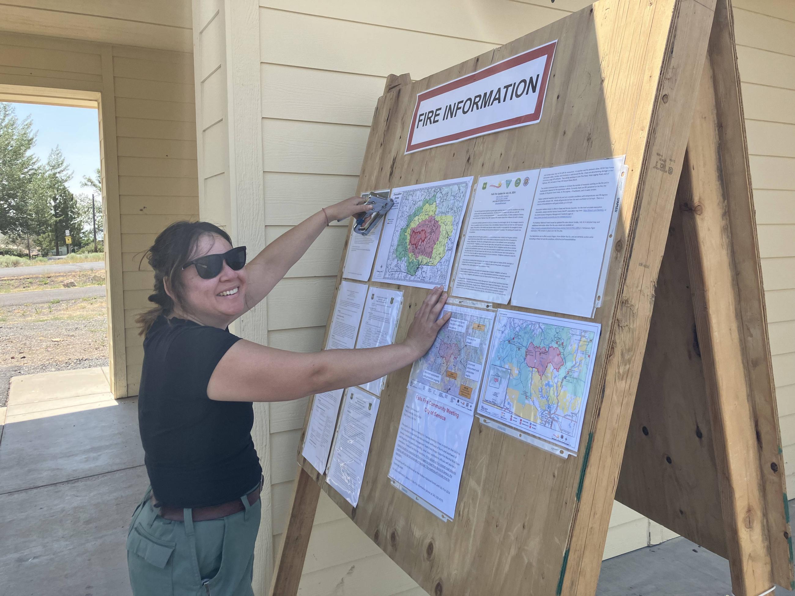 PIO Board Paiute Res. w/ Sarahi Felix PIO smiling with staple gun