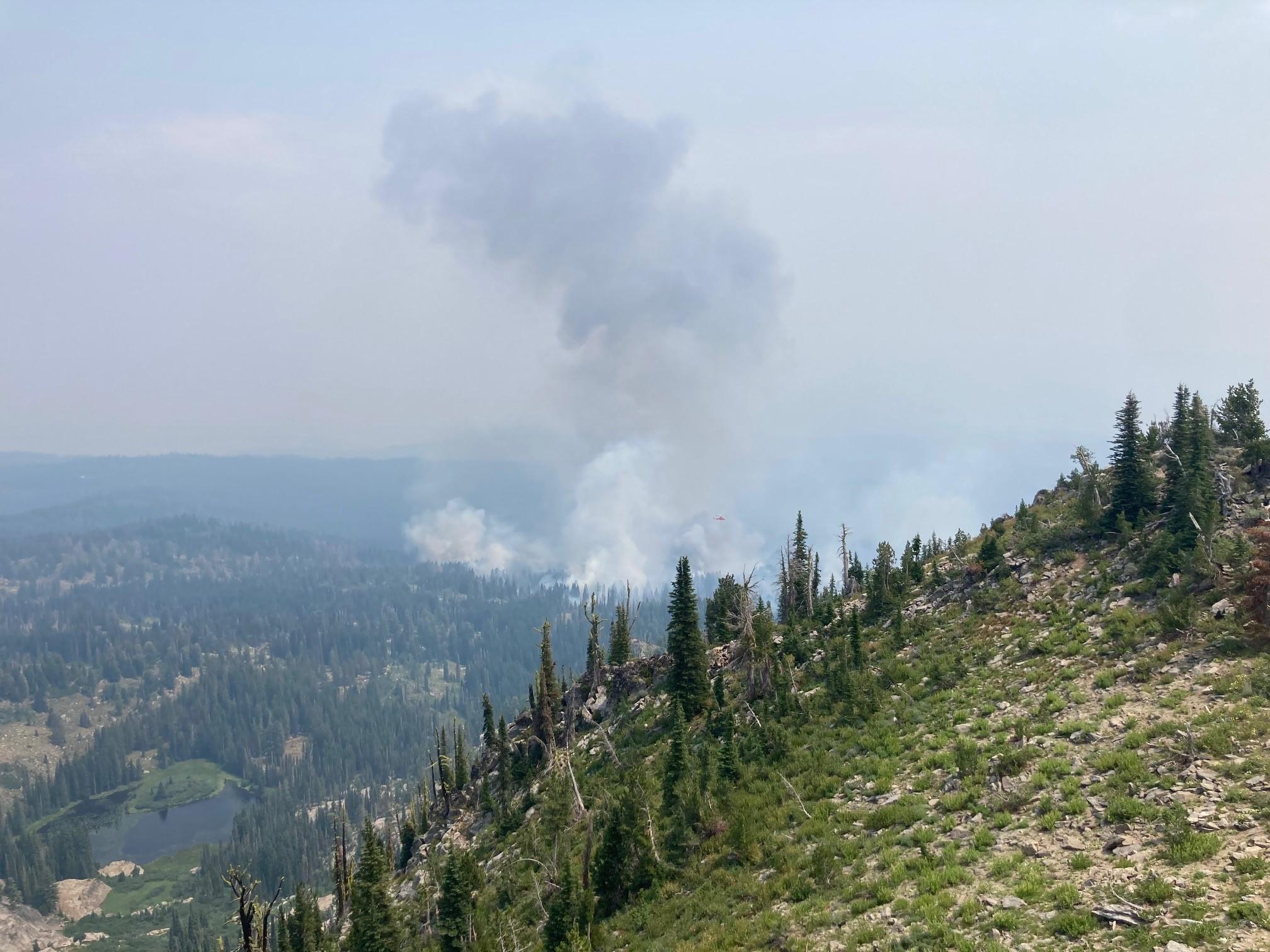 View of the fire from Tripod Lookout.  A small lake at the headwaters of the South Fork of Fawn Creek is also visible to the right.