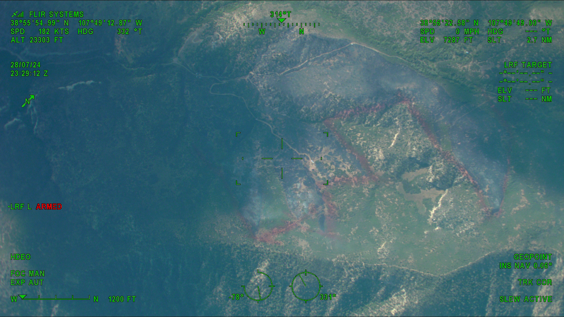 Aerial image from the State DFPC Multi-Mission Aircraft showing the fire retardant drops and burned area of the Currant Creek Fire near Cedaredge, CO