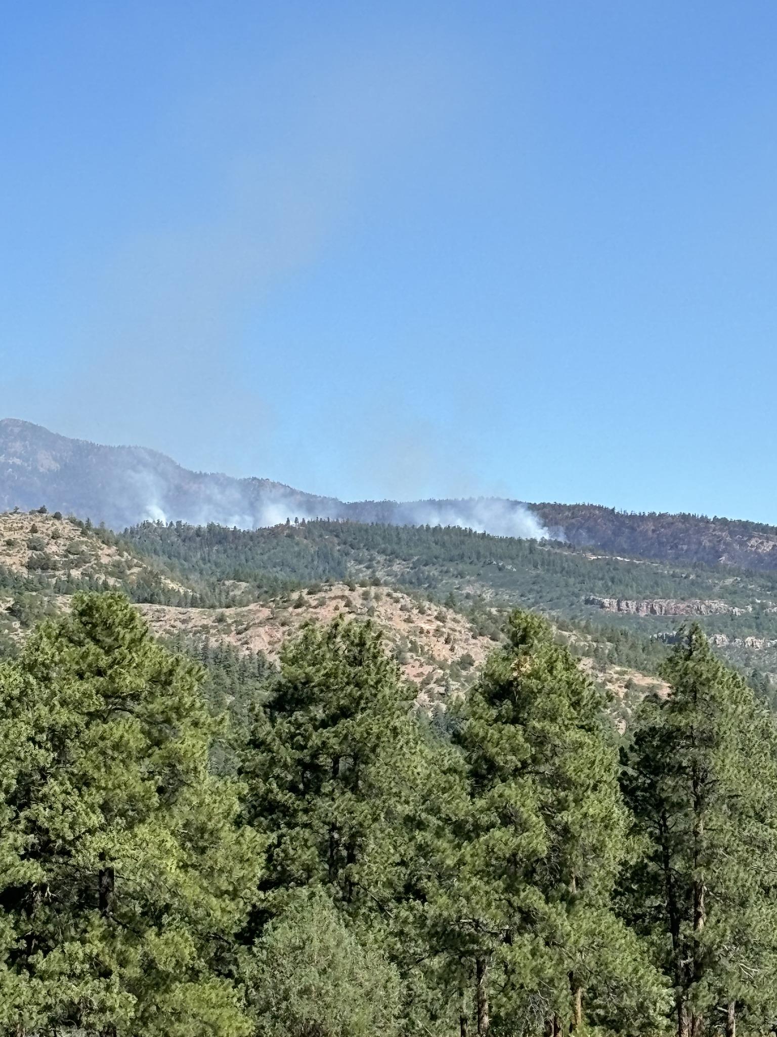 A far away shot of smoke coming up from the strategic firing operations happening on the southeast corner of the fire.
