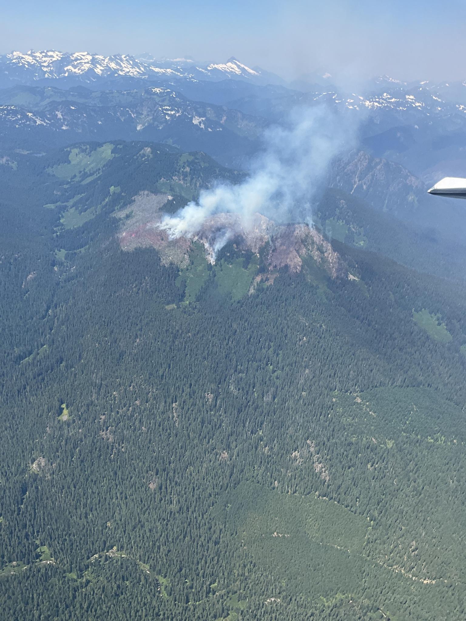 Aerial photo of smoke on top of mountain