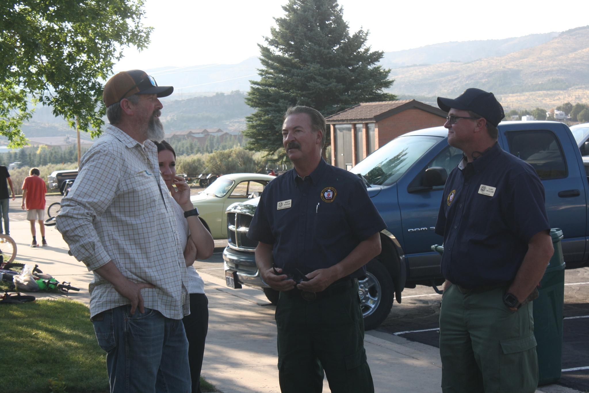 Incident Commander and Safety Officer talking to community member