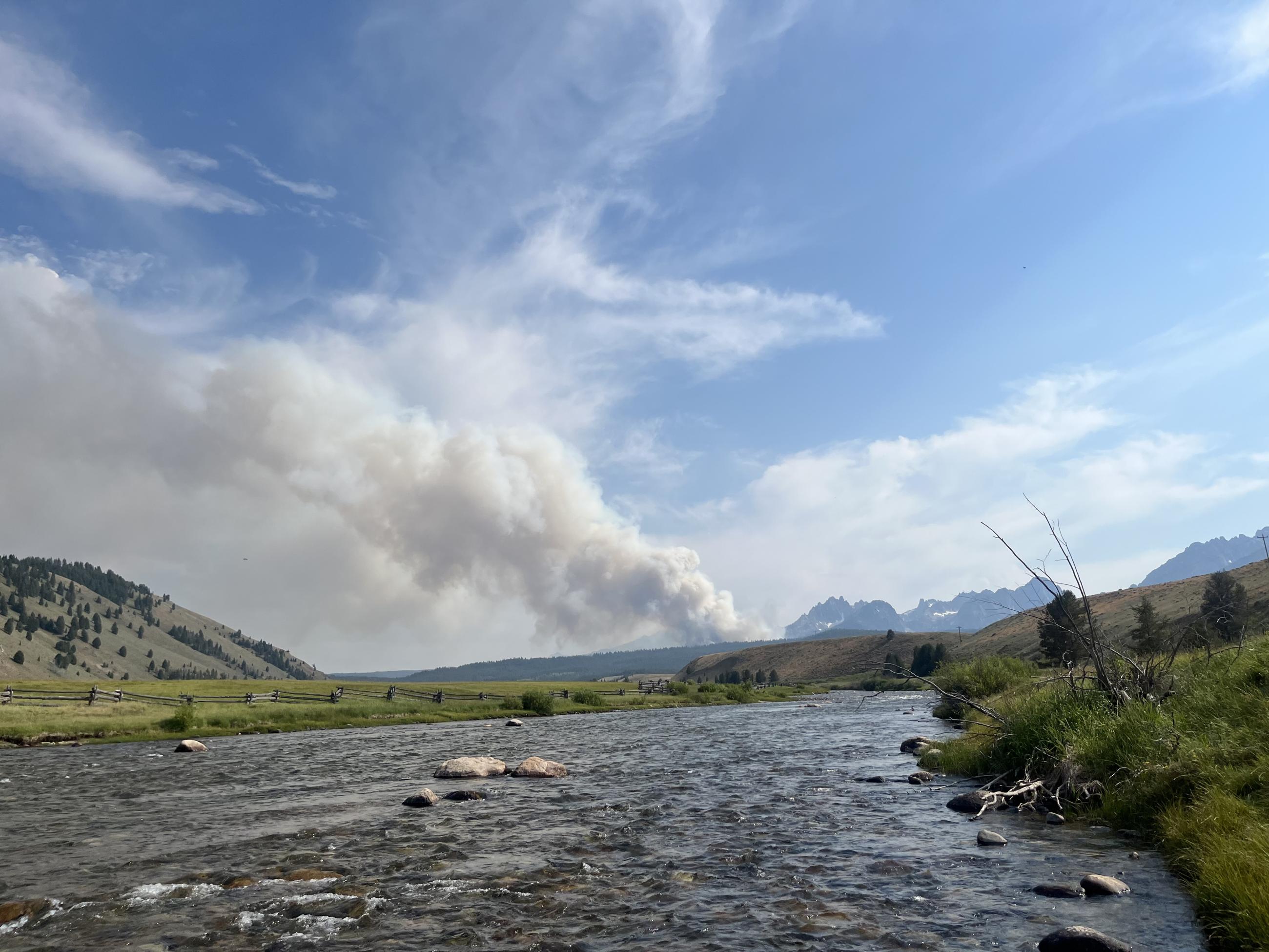 View of Bench Lake Fire with a creek in the foreground