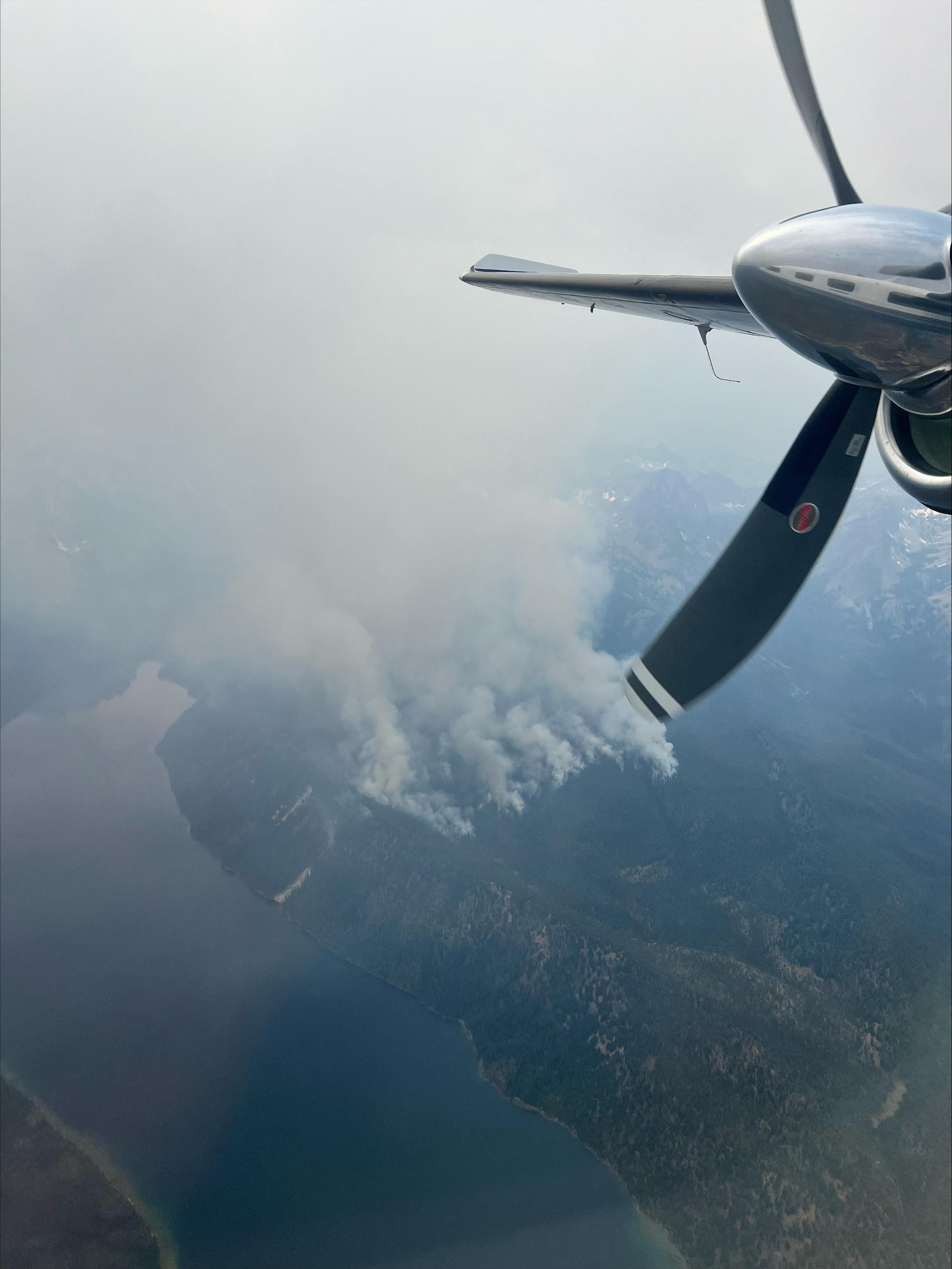 Aerial view of Redfish Lake and the Bench Lake Fire  with aircraft propeller July 14, 2024