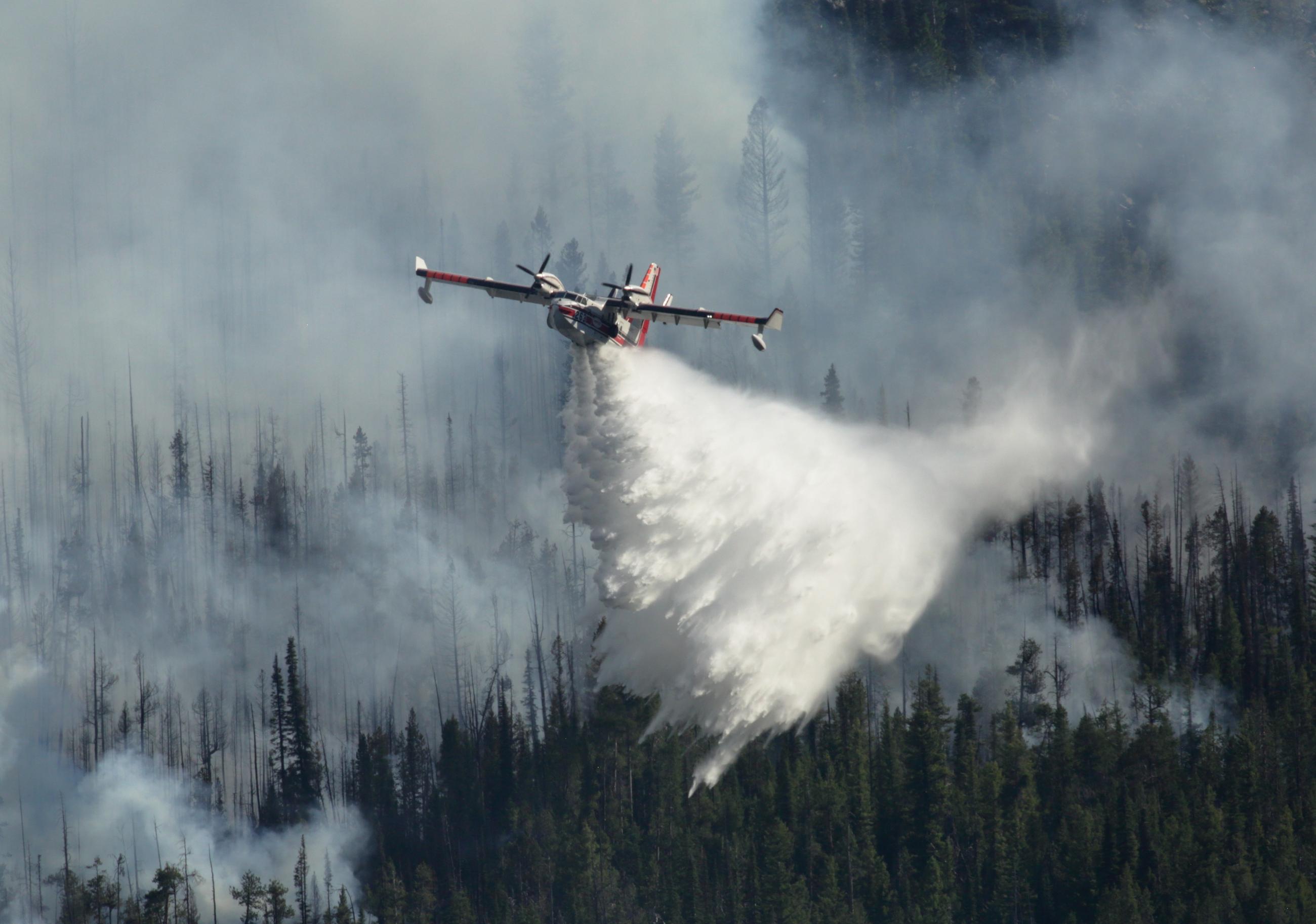 Aerial view of scooper dropping water, July 14, 2024