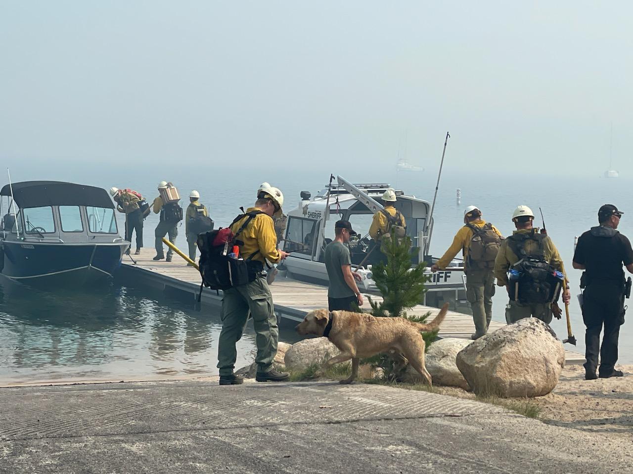 Crews load up into shuttle boats to ride across Redfish Lake to access the Bench Lake Fire.