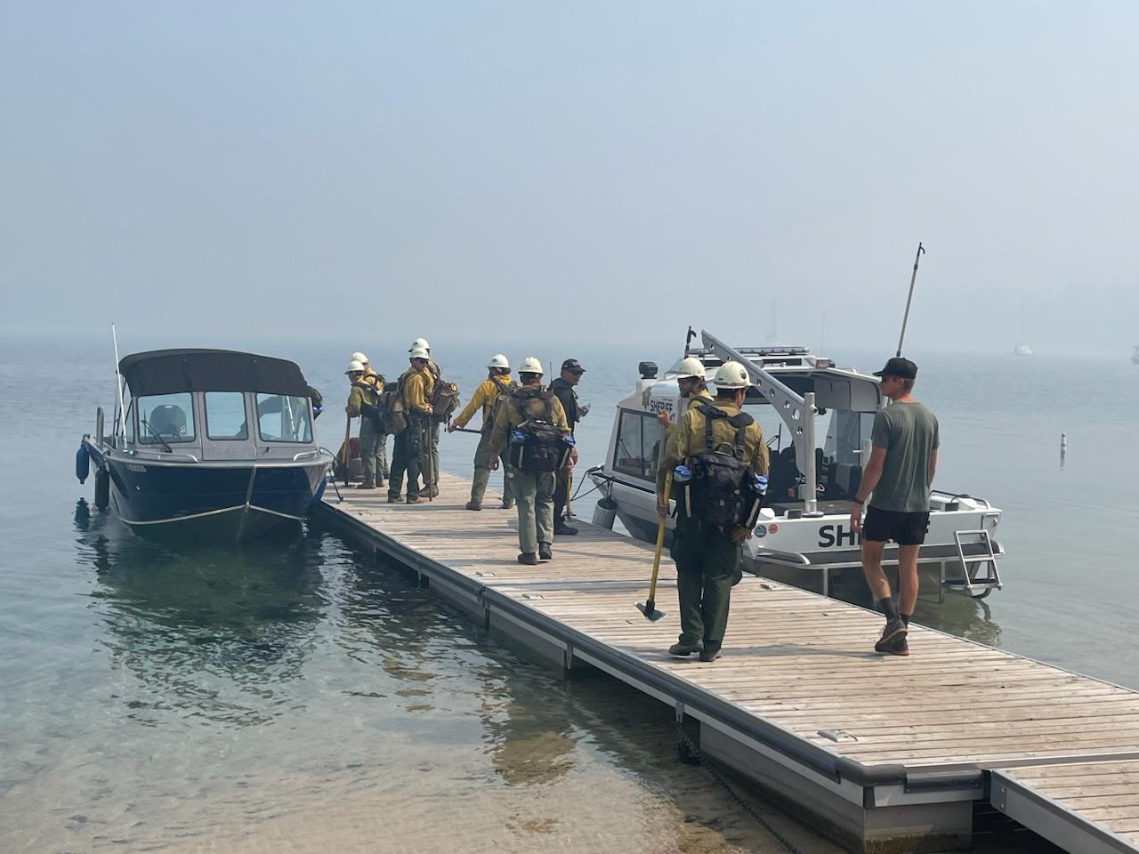 Crews load up into shuttle boats to ride across Redfish Lake to access the Bench Lake Fire.