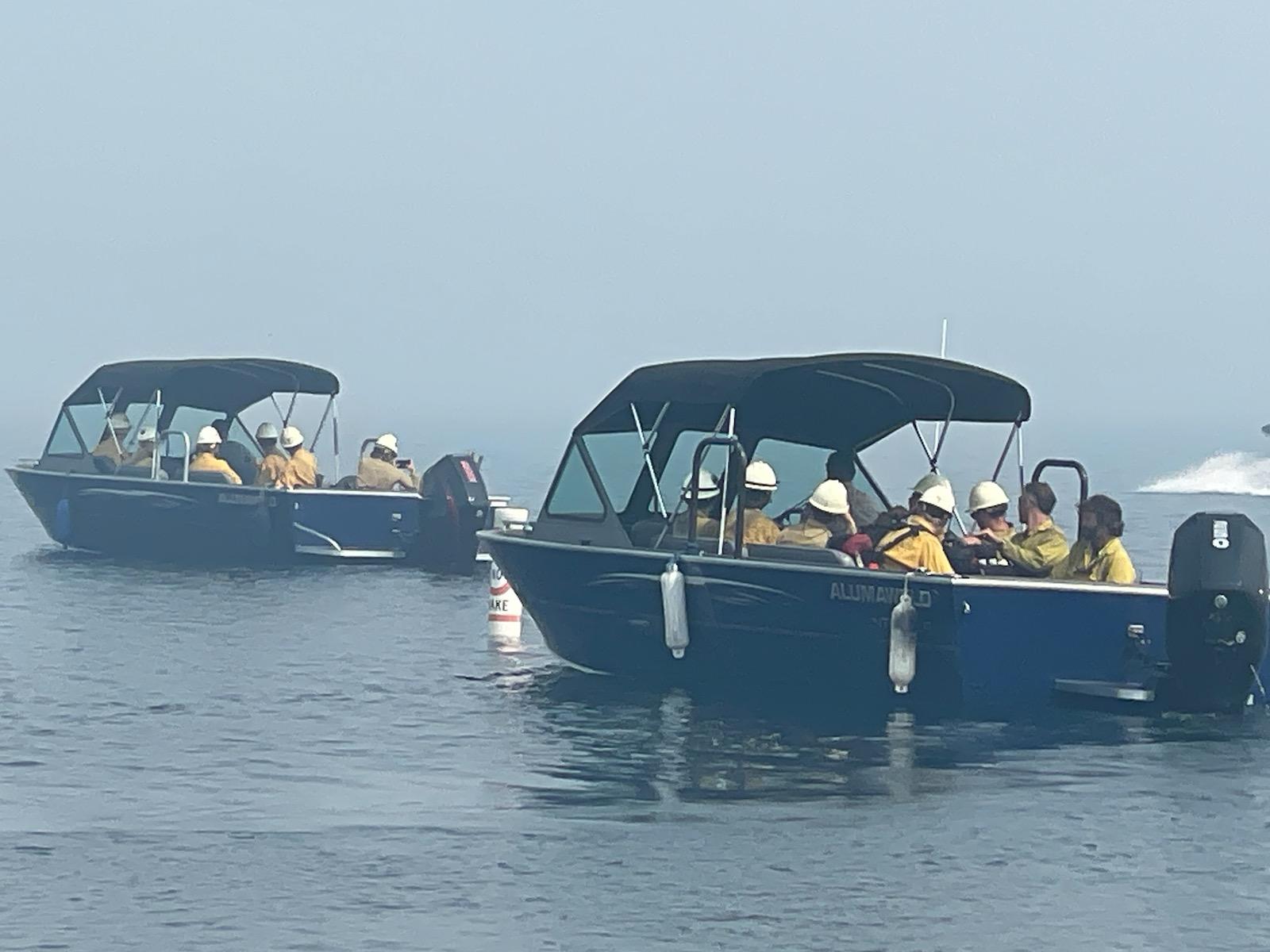 Crews ride shuttle boats across Redfish Lake to access the Bench Lake Fire.