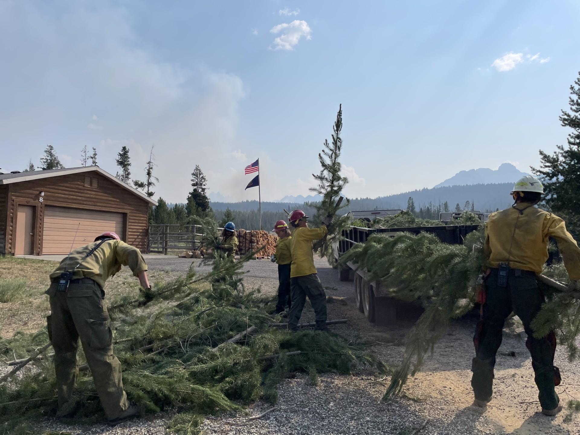 Crews conduct vegetation removal in the Stanley Ranger Station compound, July 21, 2024