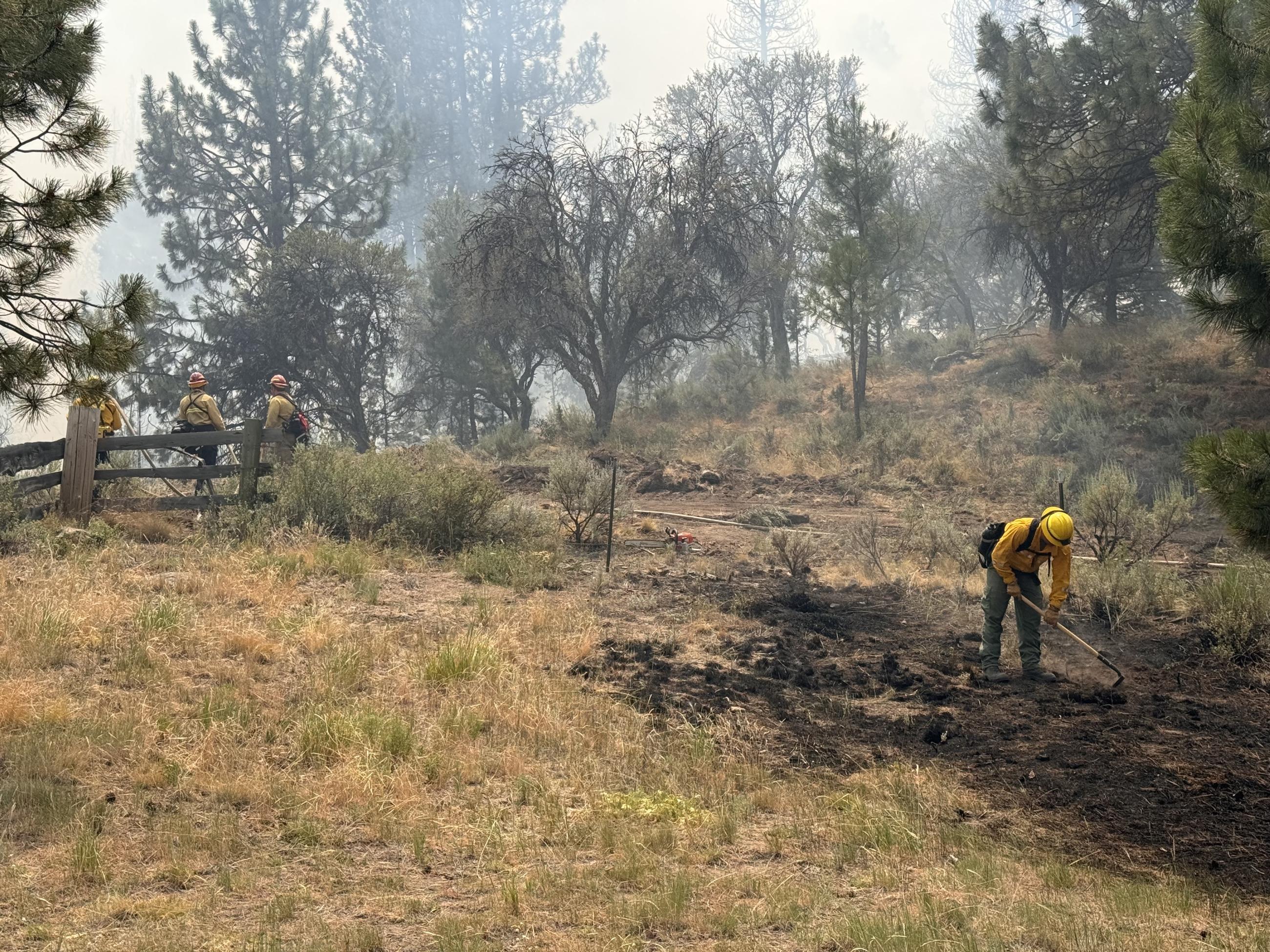 Structure firefighters protect a yurt on the Falls Fire. 2024.