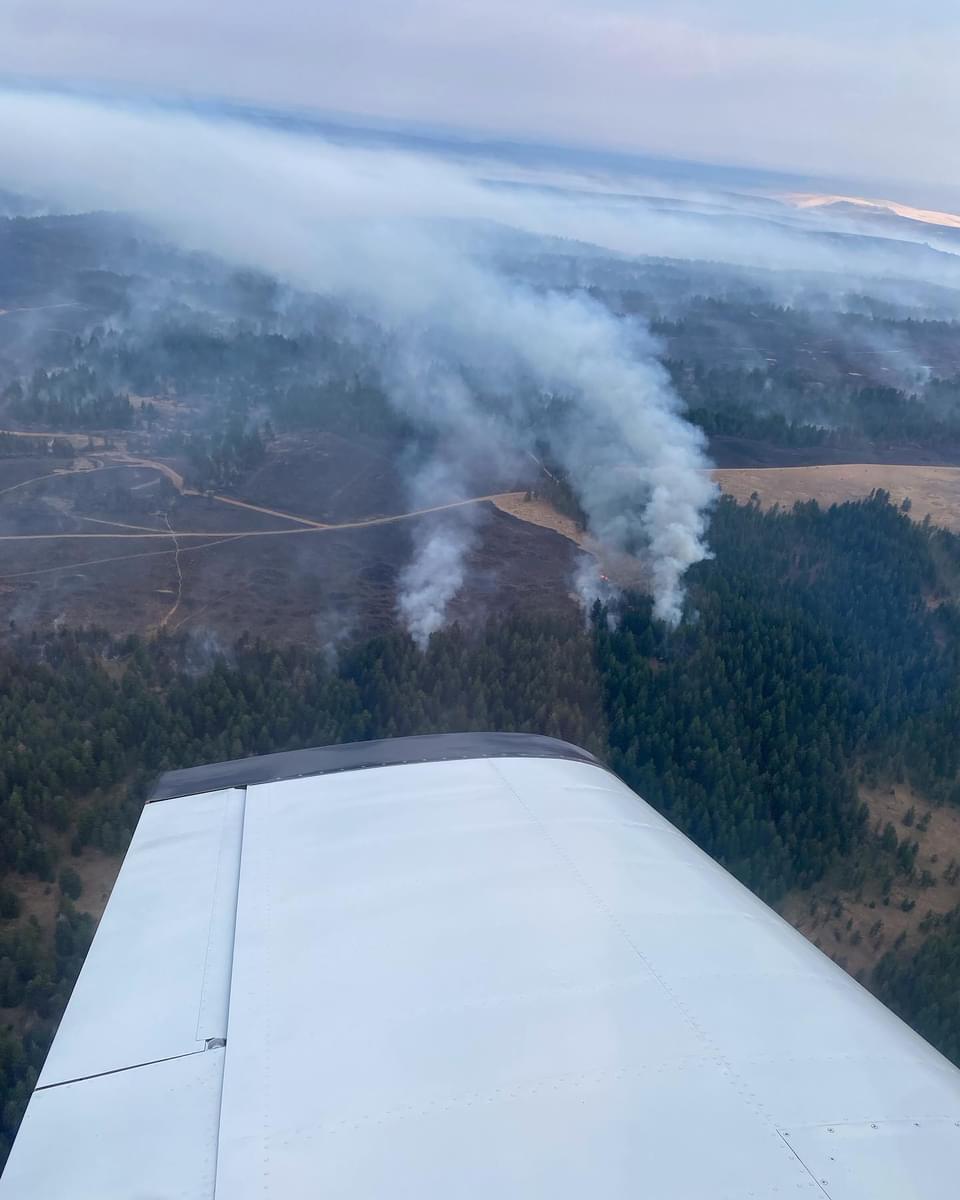 A view of a smoke column from an airplane used to help serve as an aerial observation platform