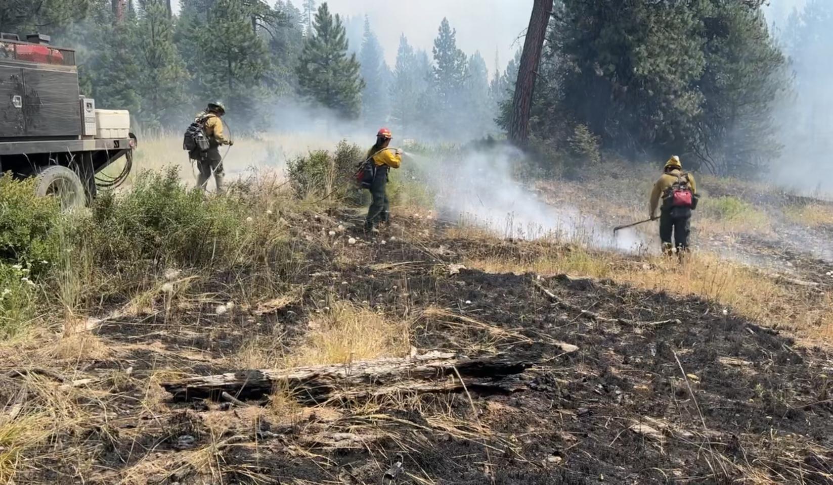 An engine crew mops up on the Lone Rock Fire