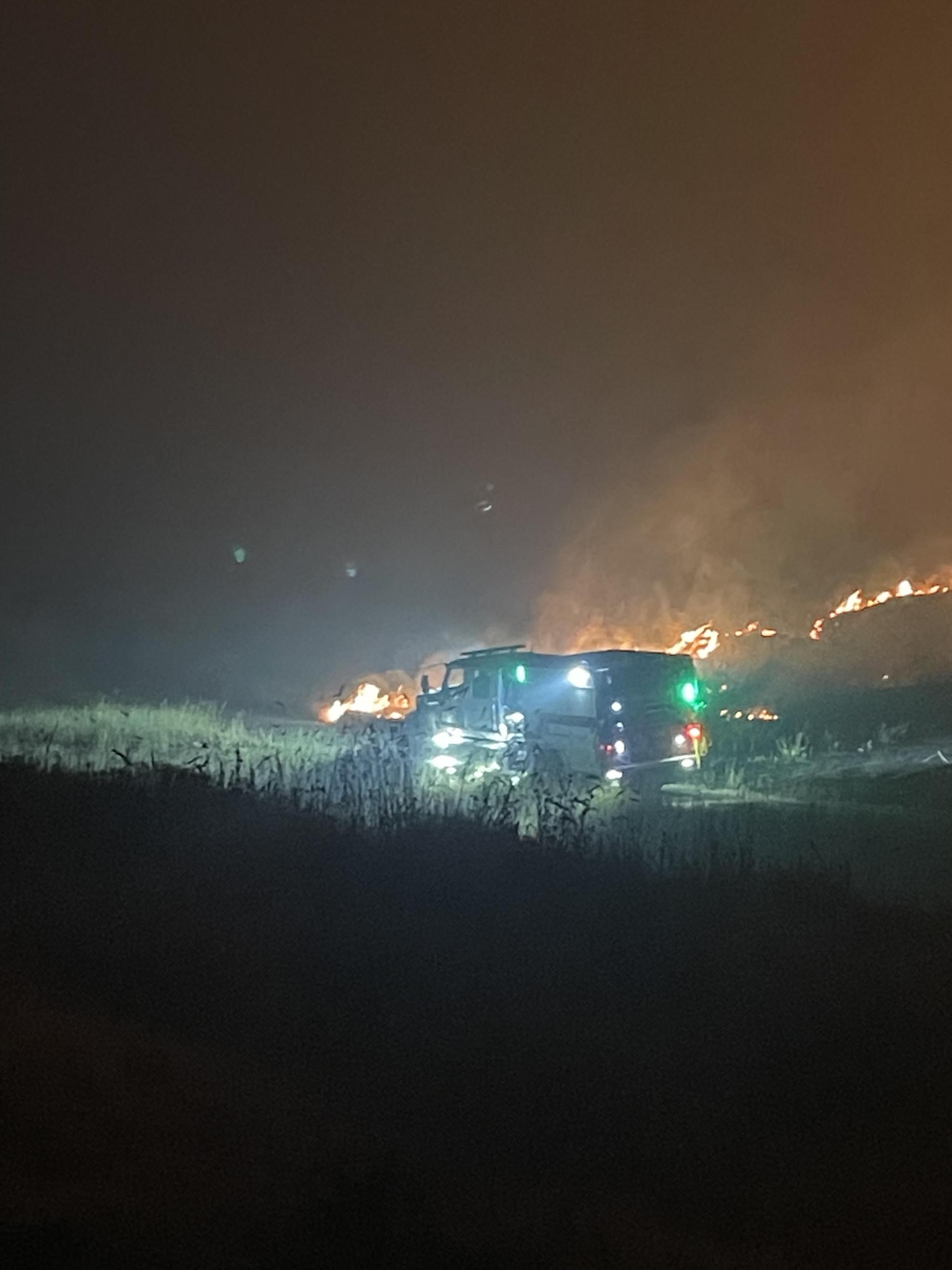 A Fire Engine with flashing lights at night on the Lone Rock Fire