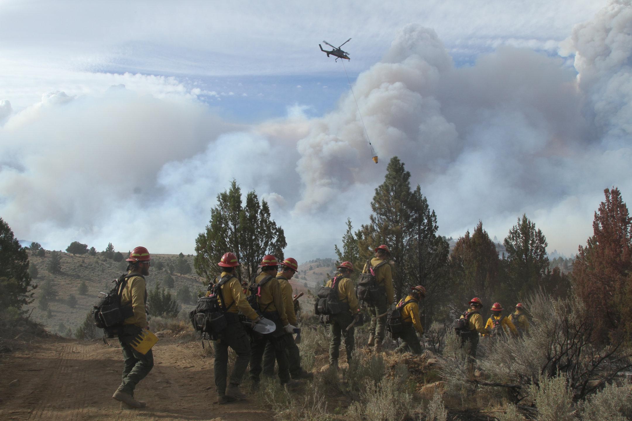 Hand Crew Hikes to Fireline with Helicopter Support