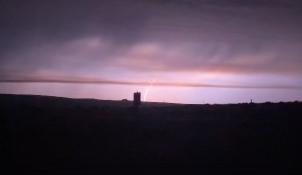 A photo of a lightning downstrike on the Lone Rock Fire