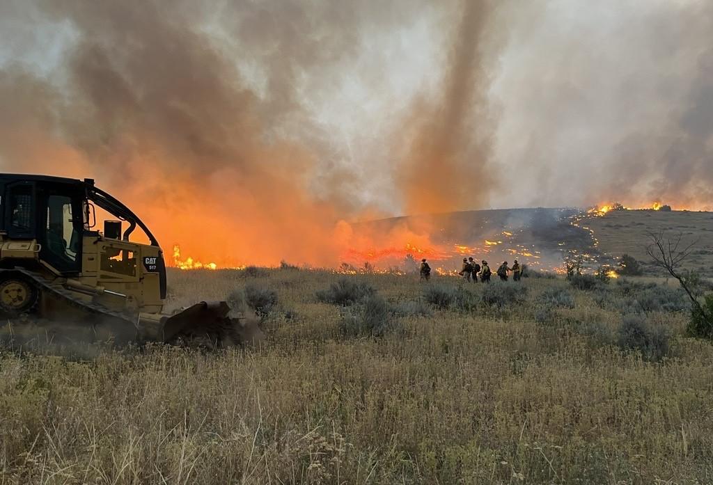 Firefighters and Dozer operators fight fire on Butler Creek