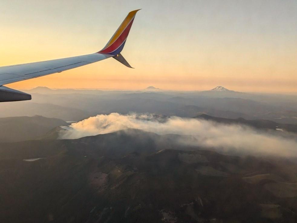 View of Whisky Creek Fire smoke drifting over the landscape from an airliner.