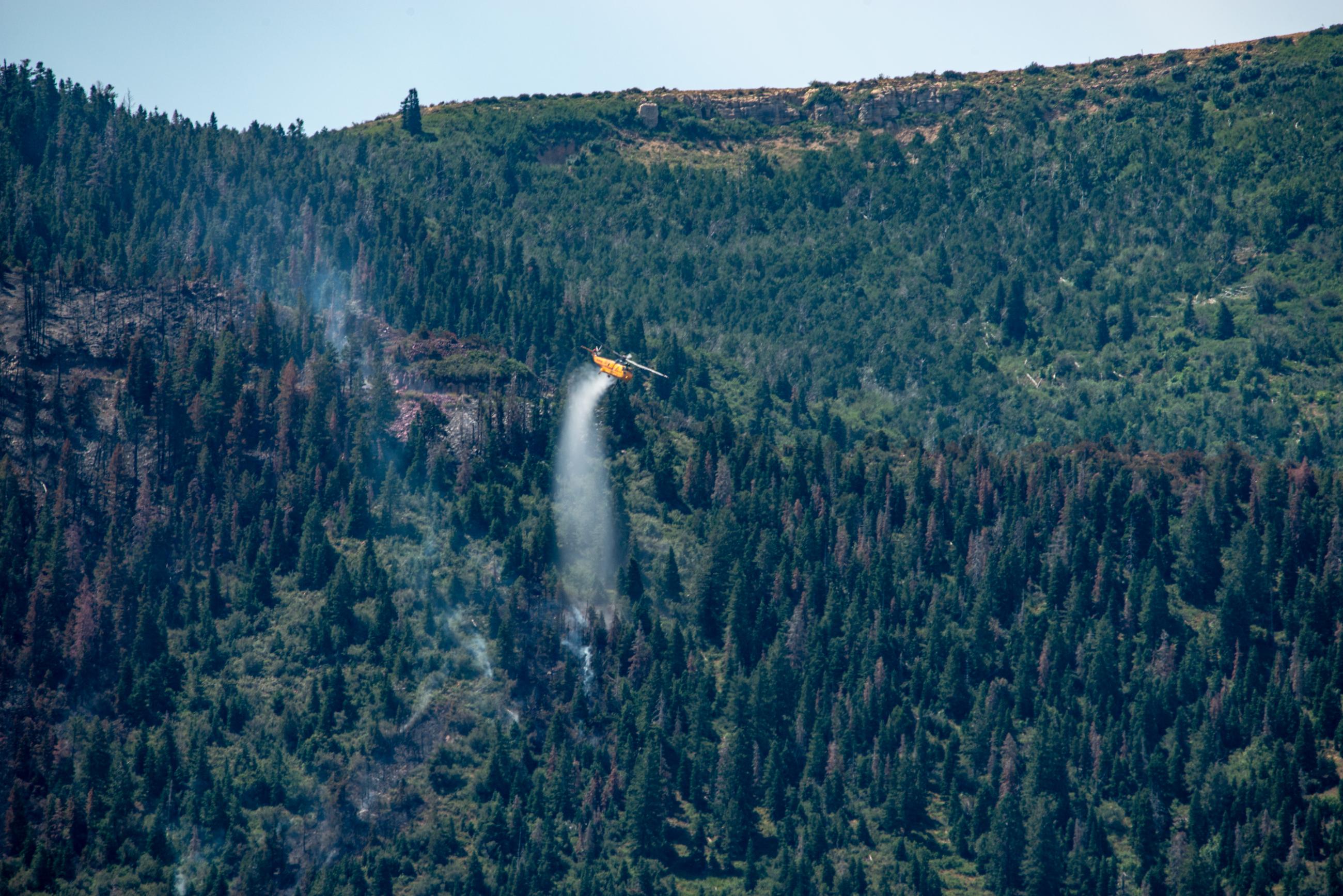 Kmax Helicopter Drops Water to Cool Hot Spots