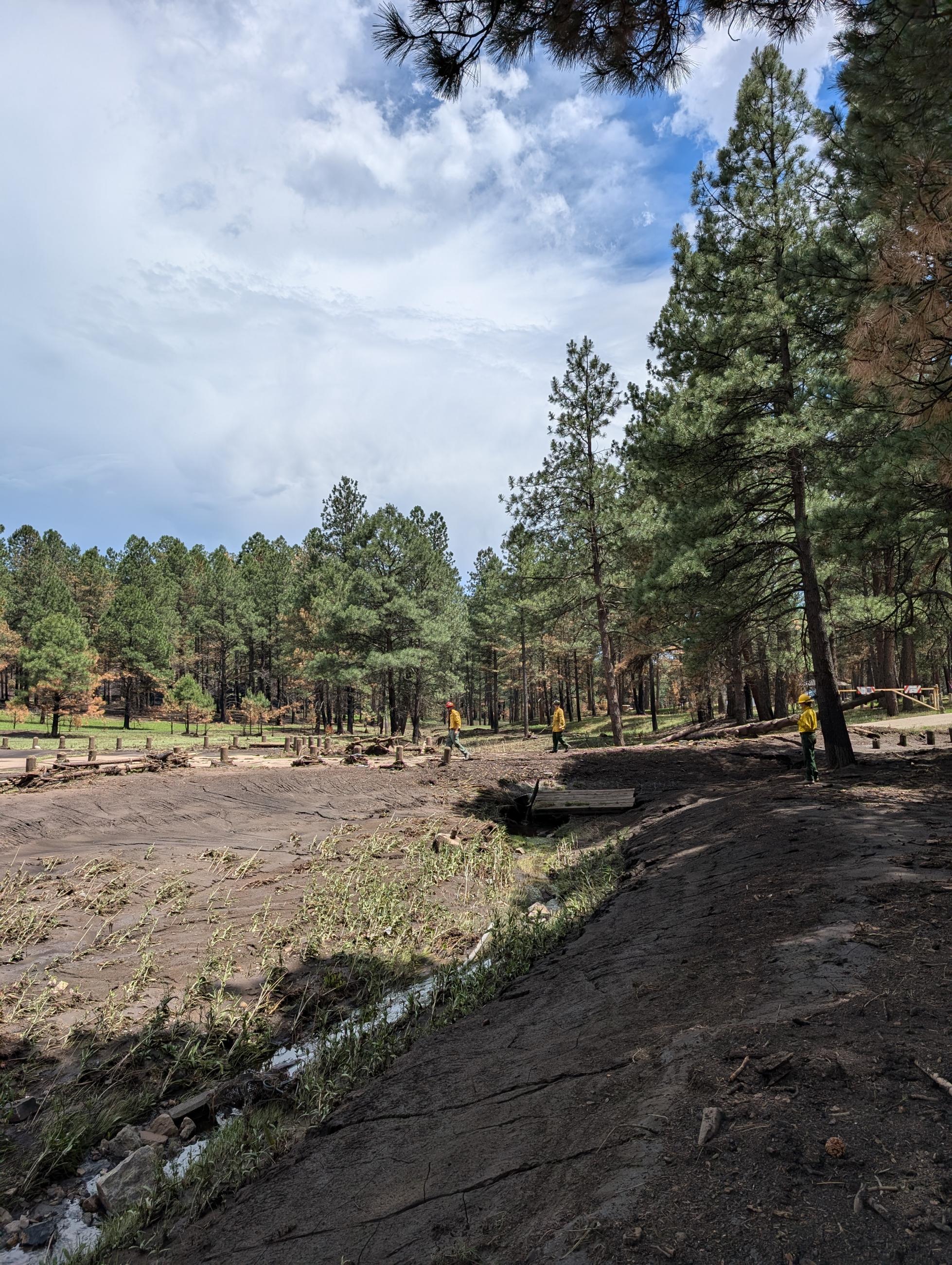 Image showing BAER Hydrologist and Recreation Specialist Evaluating burned recreation site in the South Fork burned area