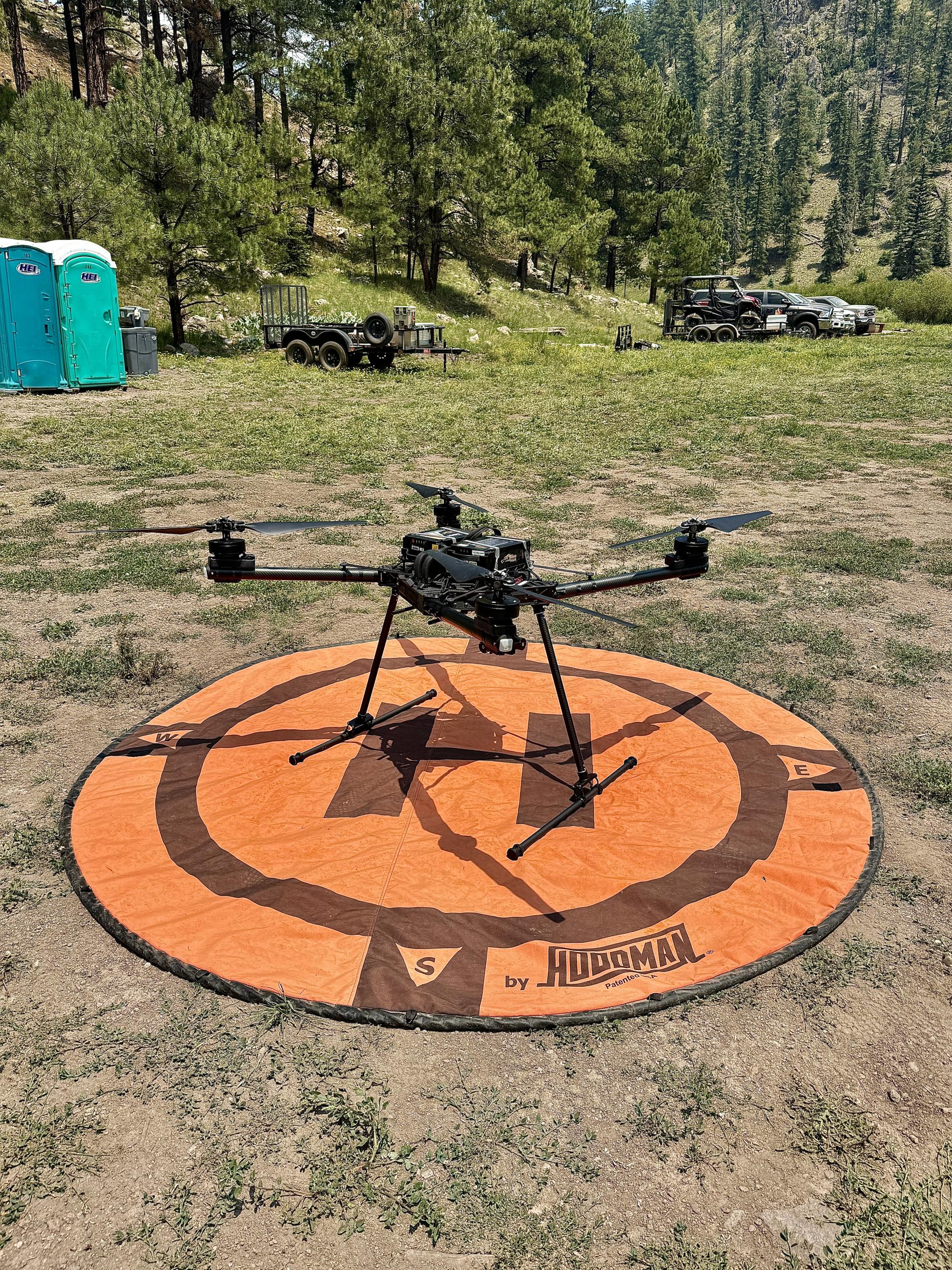 Picture of drone on orange landing pad being used for Ridge Fire. 