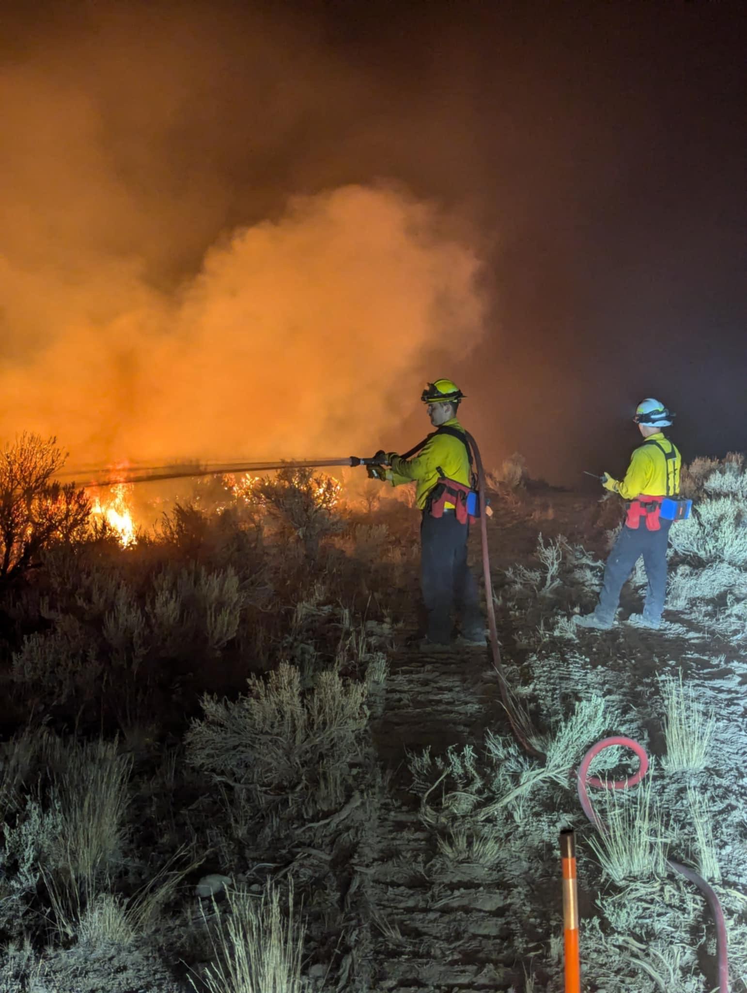 Firefighters Spraying Water