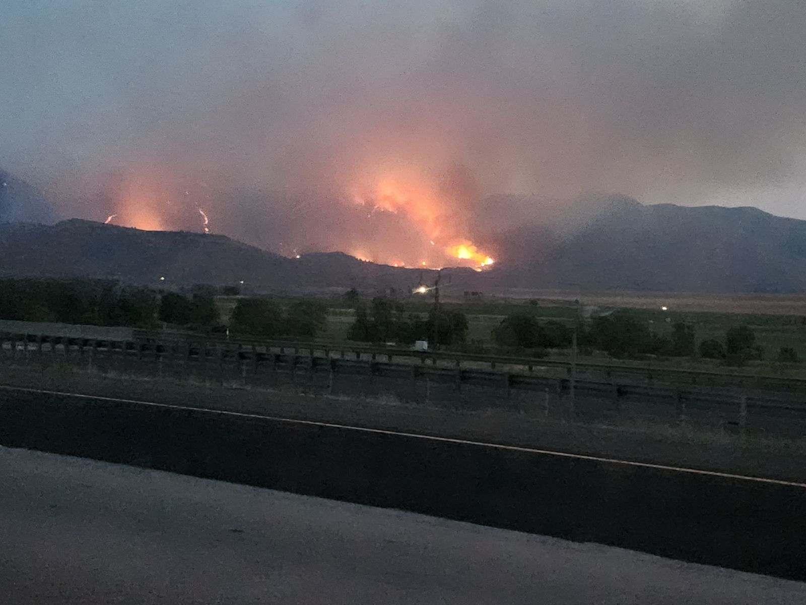 View of fire flames from the road.