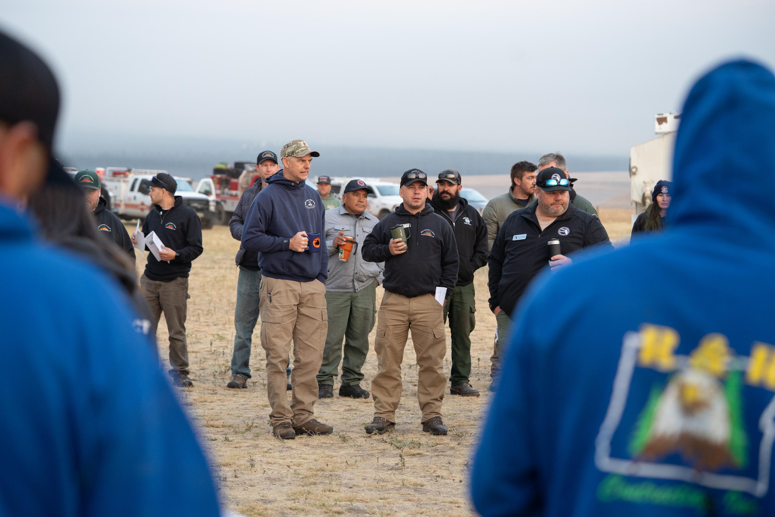Image of ODF IMT 3 staff at a morning briefing for the Battle Mountain Complex.