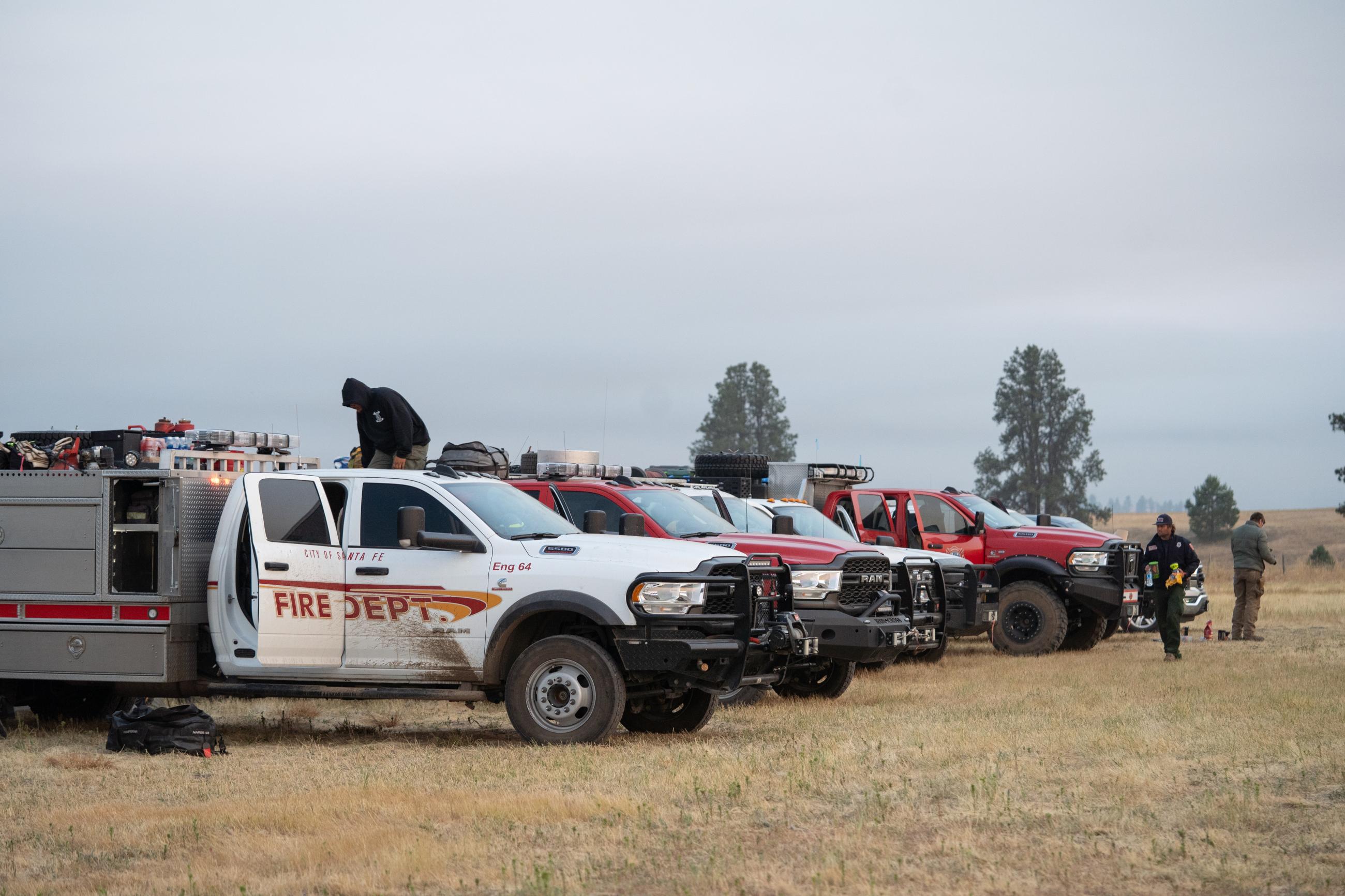 Image of fire engines staging at a base camp for the Battle Mountain Complex. 