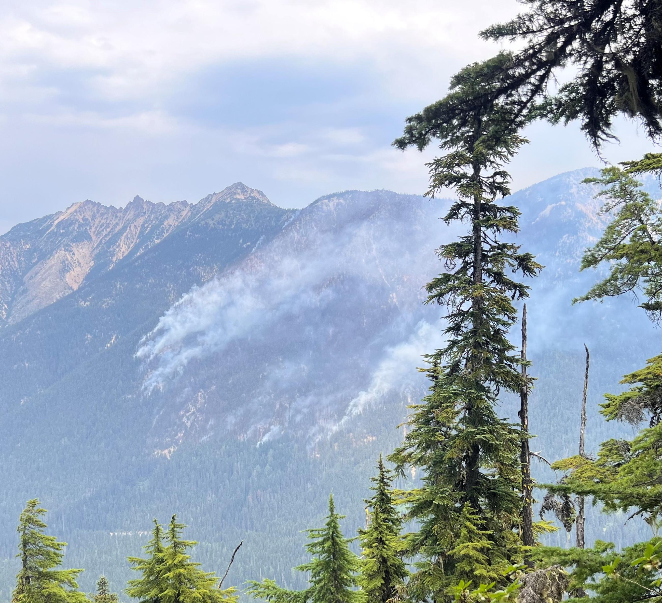 Smoke indicating fire activity on upslope.