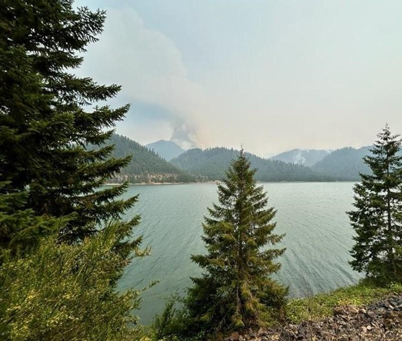 smoke rises from the coffeepot fire with Hills creek lake in the foreground july 24