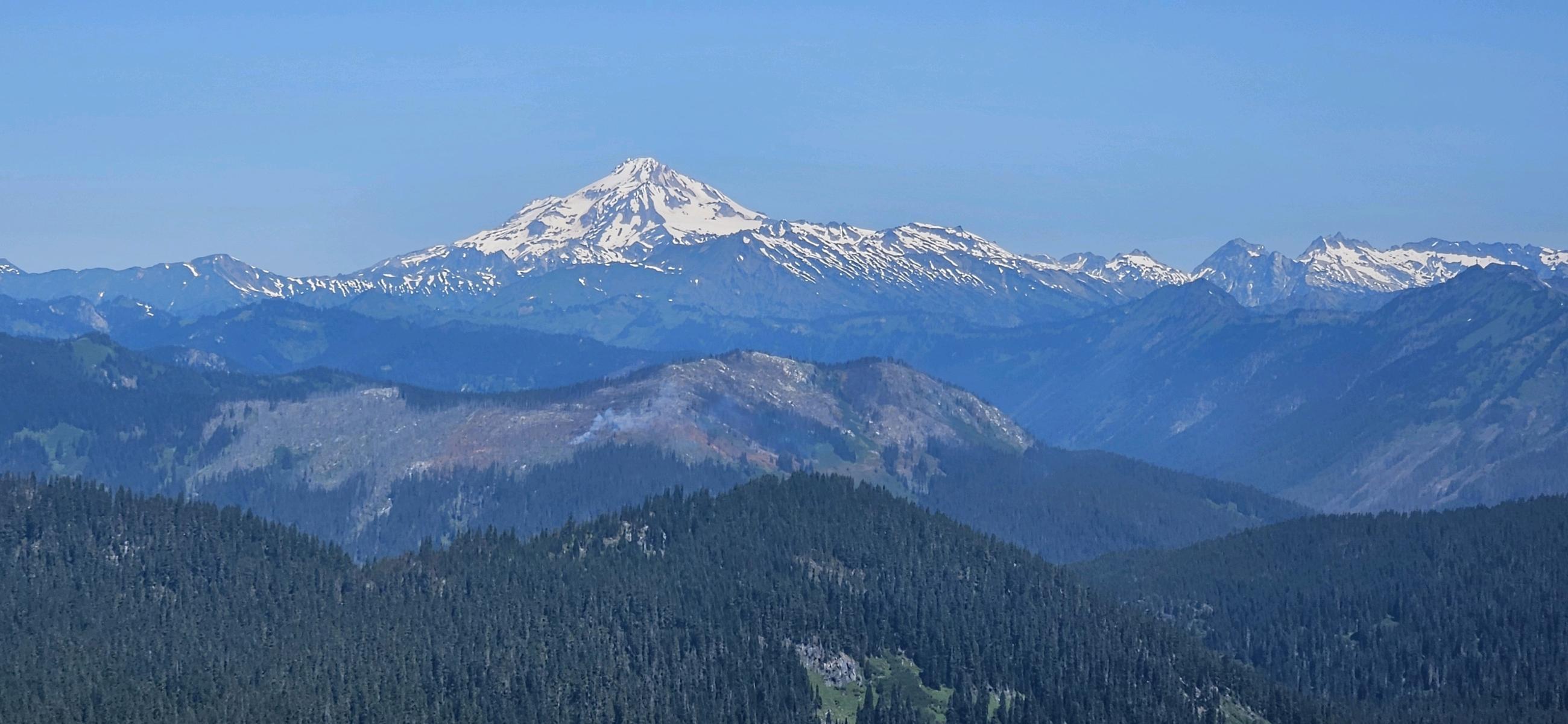 Footprint of Shoofly Fire. A Panorama of Mountains and Glacier Peak looking north from the summit of Mount McCausland. 