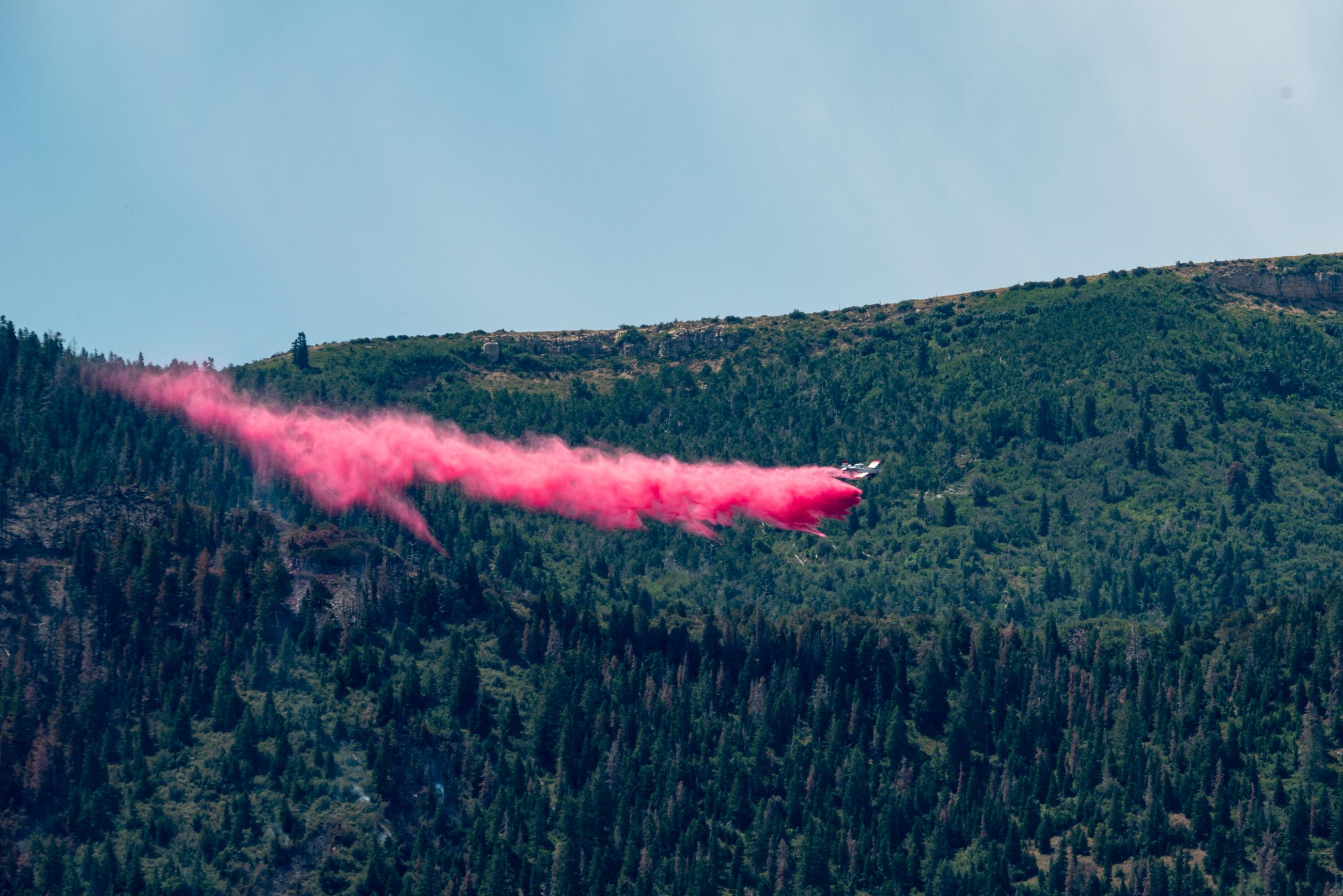 Single Engine Air Tanker (SEAT) Drops Retardant to Slow Fire Spread