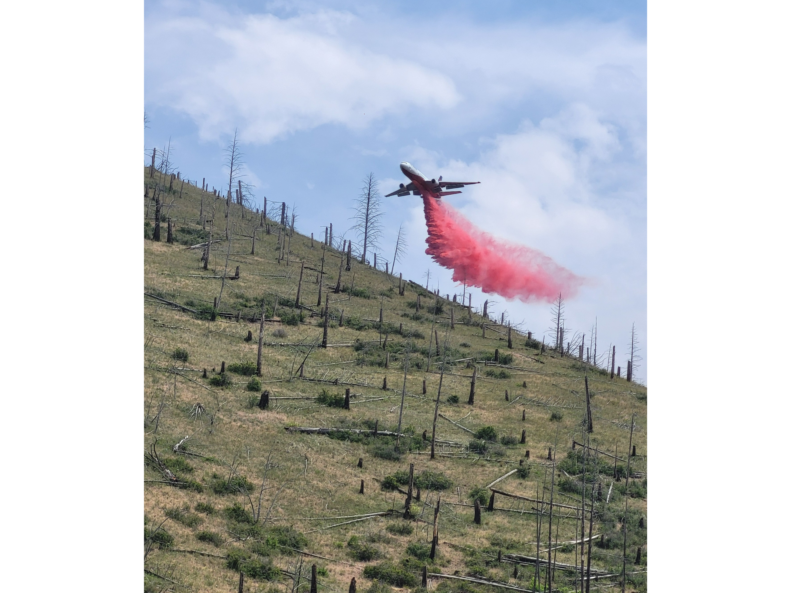 Retardant drop by DC10 in Magpie Gulch to in preparation of fire line construction.