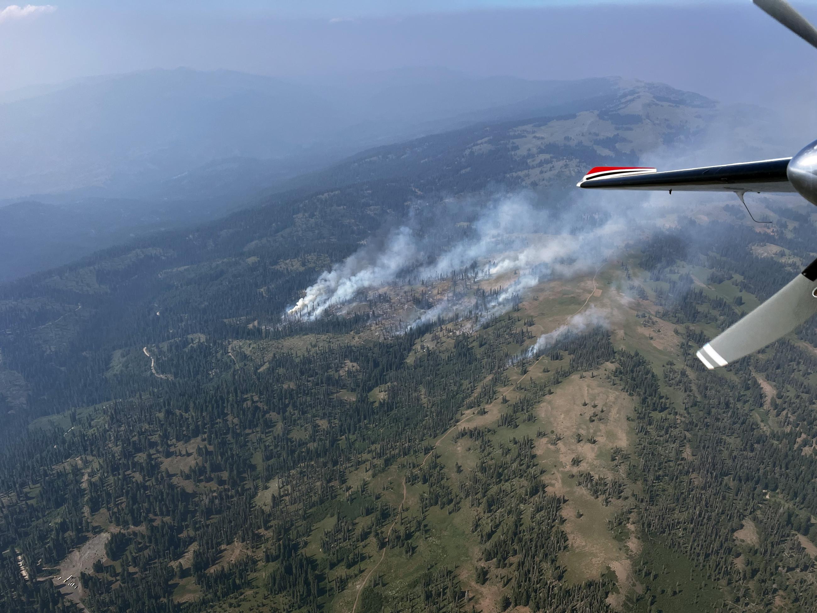 Aerial photo shows the Wolf Creek Fire mid-afternoon on July 25