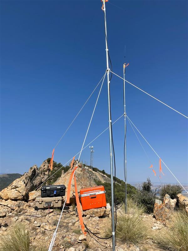 radio antennae installed high on mountain to improve communications