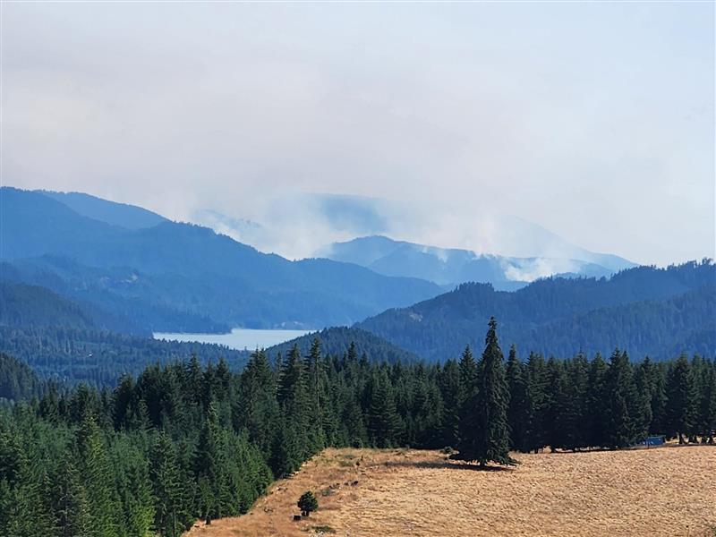 smoke rises from the coffeepot fire with Hills creek lake in foreground, July 25